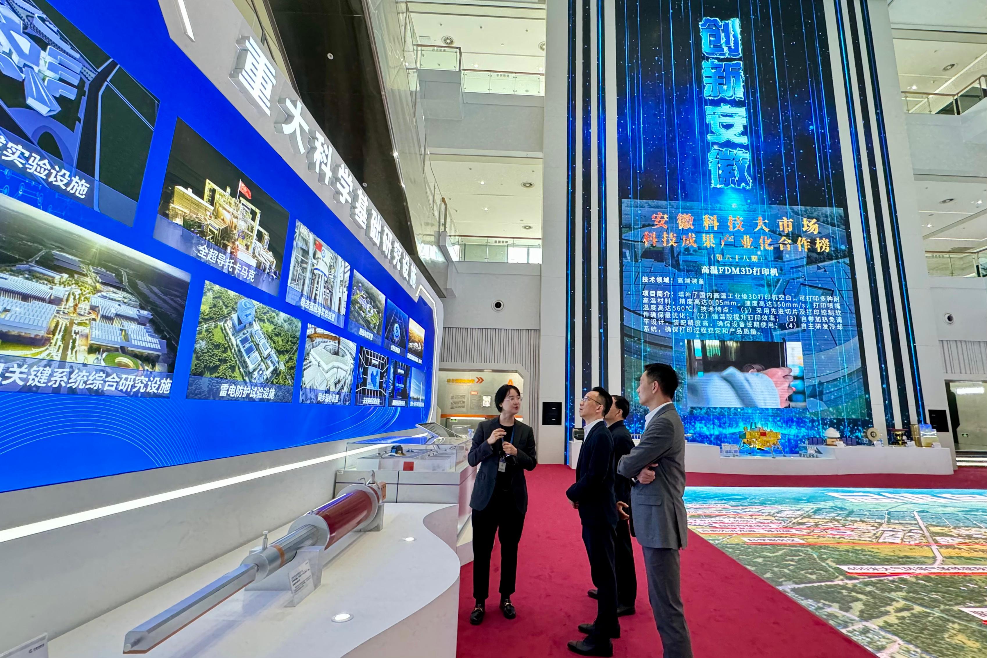 The Permanent Secretary for Security, Mr Patrick Li (centre), visits the Anhui Innovation Pavilion on April 18 to learn about its relevant research and development as well as products.
