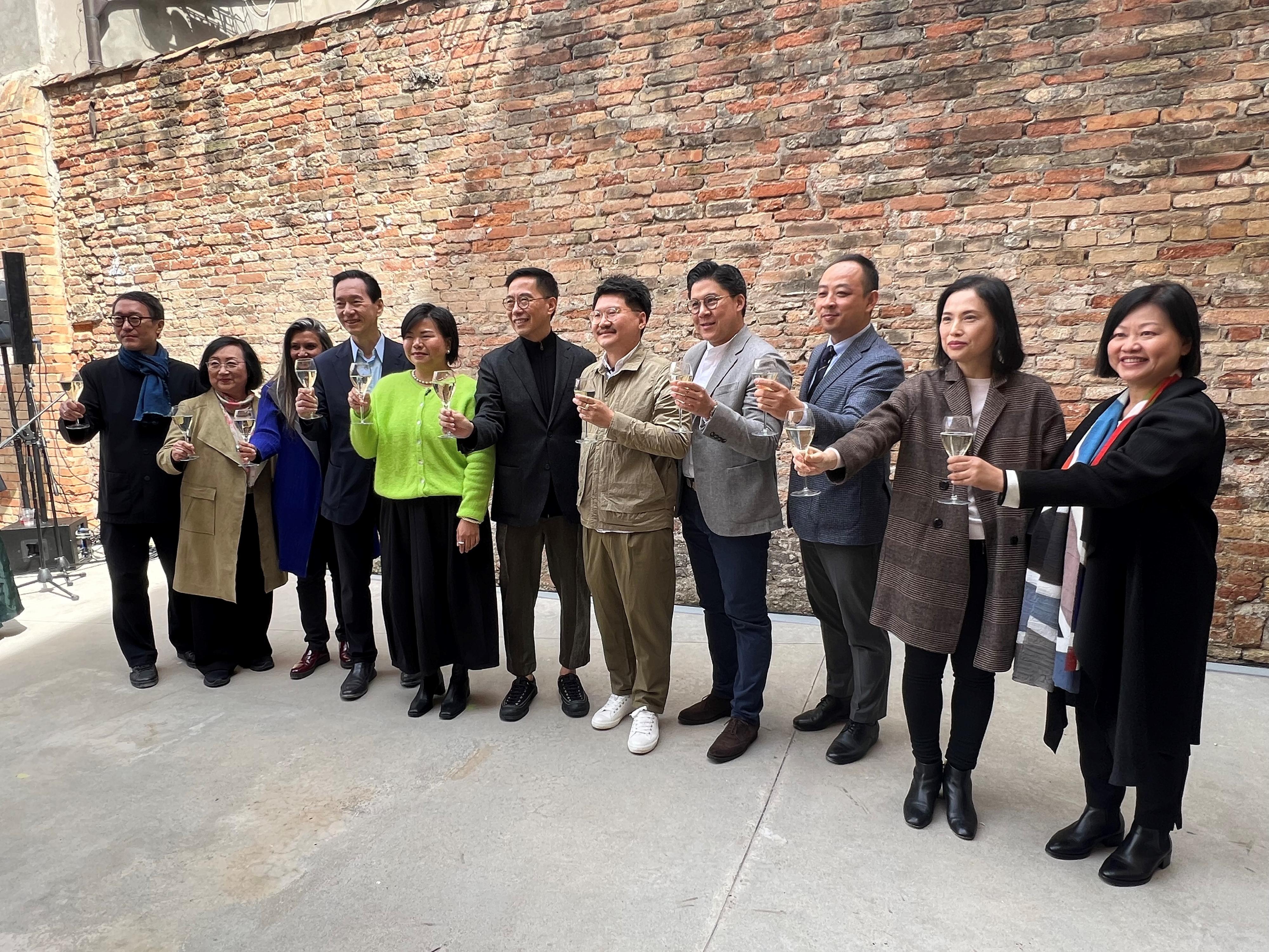 The Secretary for Culture, Sports and Tourism, Mr Kevin Yeung, officiated at the opening ceremony of the Hong Kong exhibition at the Venice Biennale in Venice, Italy, yesterday (April 19, Venice time). Photo shows Mr Yeung (centre) giving a toast with guests including the Chairman of the M+ Board, Mr Bernard Charnwut Chan (fourth left); the Chief Executive Officer of the West Kowloon Cultural District Authority, Mrs Betty Fung (second right); the Chairman of the Hong Kong Arts Development Council, Mr Kenneth Fok Kai-kong (fourth right); Hong Kong artist Trevor Yeung (fifth right), and curator Olivia Chow (fifth left). 