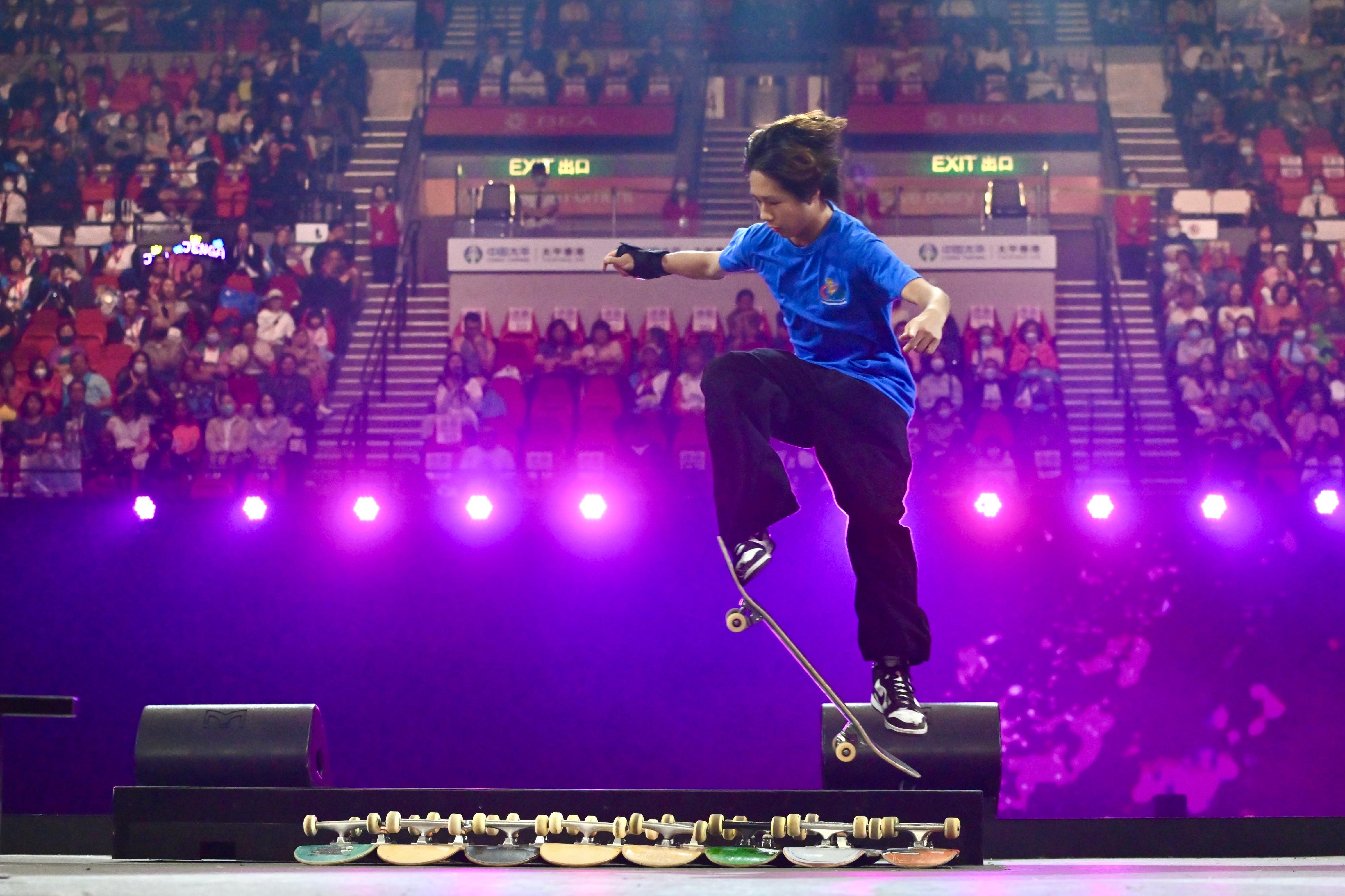 A member from the Hong Kong China Federation of Roller Sports and Skateboarding demonstrate various skateboarding skills at the 9th Hong Kong Games Opening Ceremony today (April 21).
