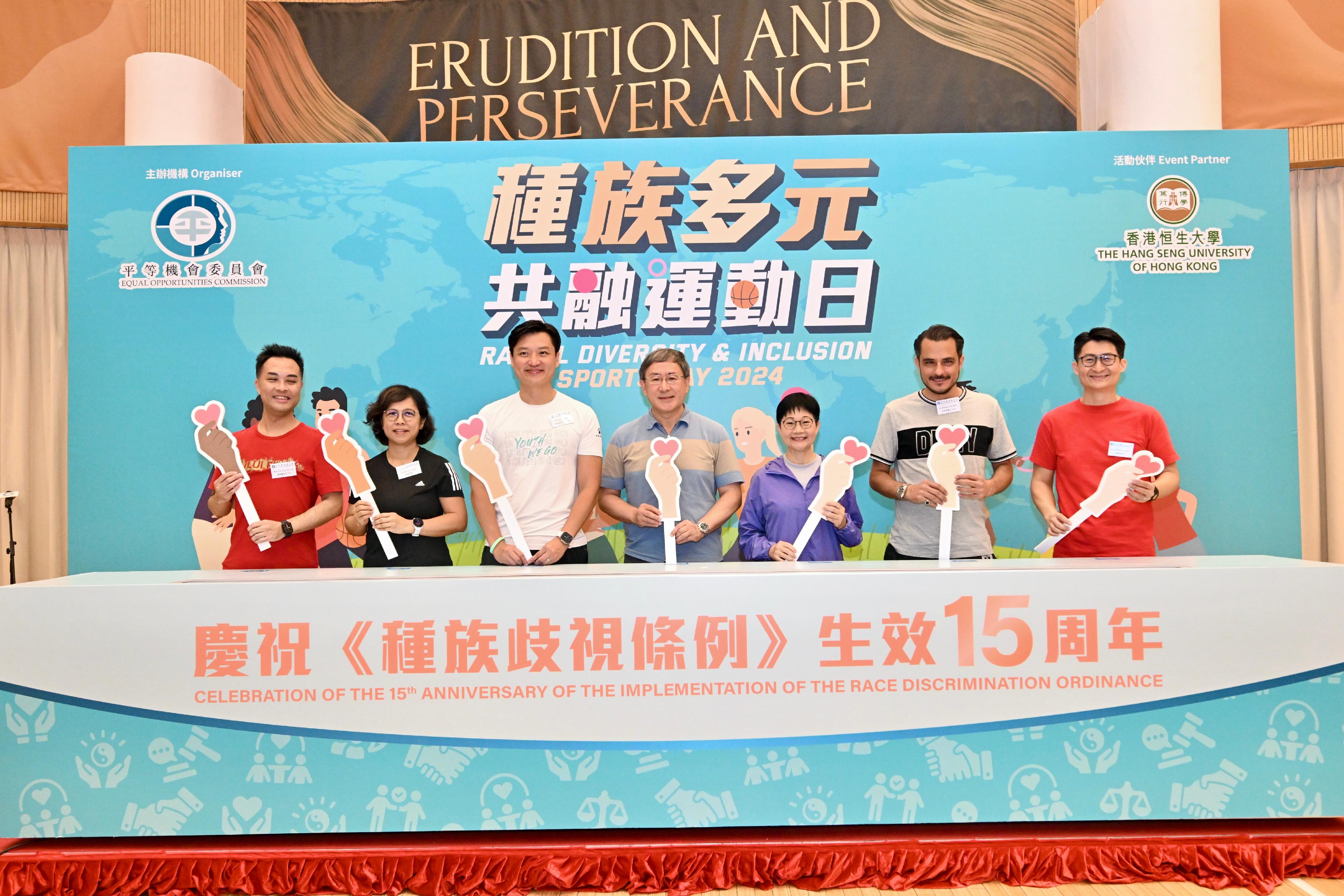 The Deputy Chief Secretary for Administration, Mr Cheuk Wing-hing, attended the Opening Ceremony of the Racial Diversity and Inclusion Sports Day 2024 today (April 21). Photo shows Mr Cheuk (centre), the Chairperson of the Equal Opportunities Commission, Ms Linda Lam (third right), Legislative Council member Mr Vincent Cheng (third left) and other guests at the ceremony.