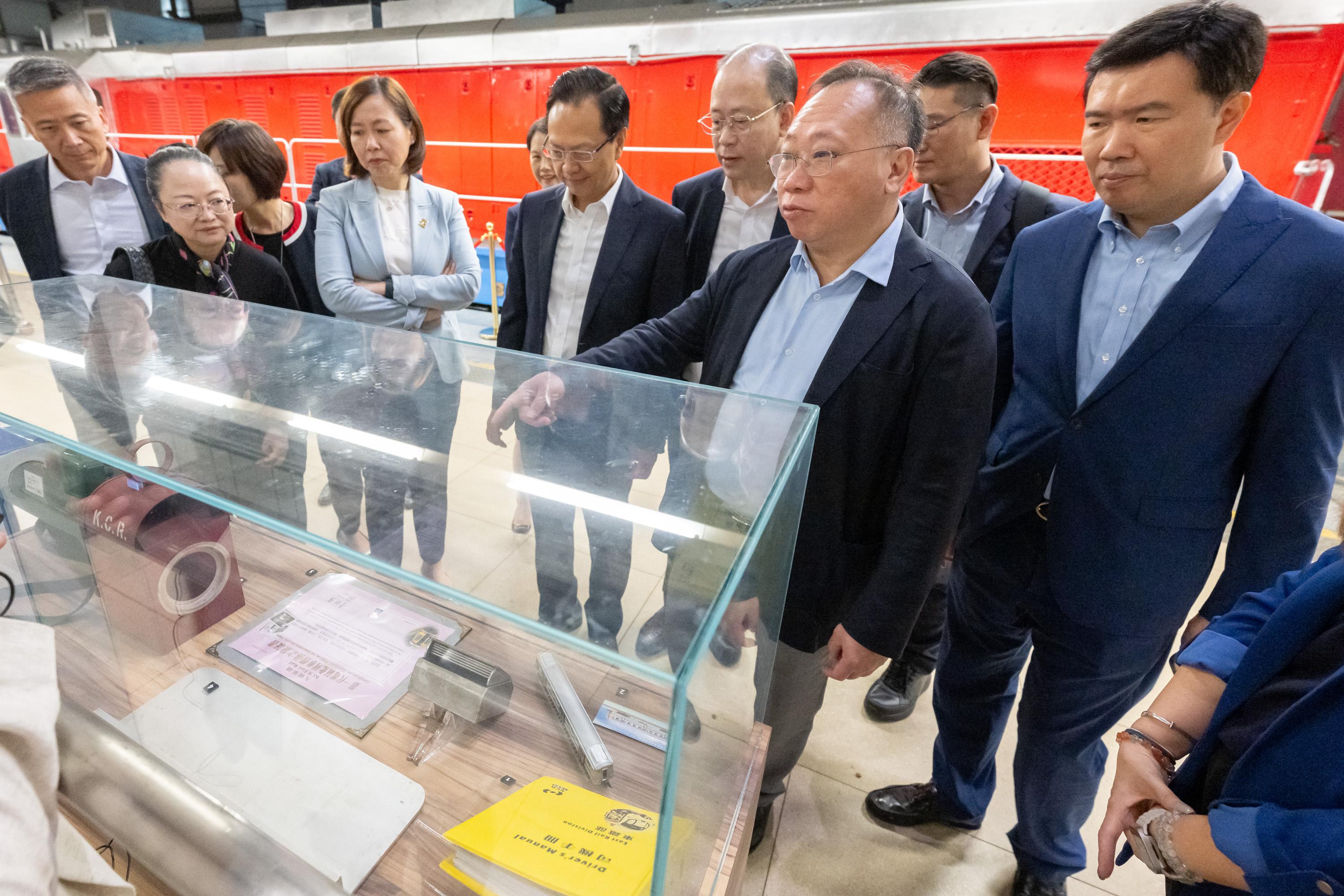 The Legislative Council (LegCo) Panel on Transport visited the "Station Rail Voyage" Exhibition of the MTR Corporation Limited at Hung Hom Station today (April 24). Photo shows LegCo Members receiving a briefing on the exhibits of "Station Rail Voyage" Exhibition by MTR representatives.