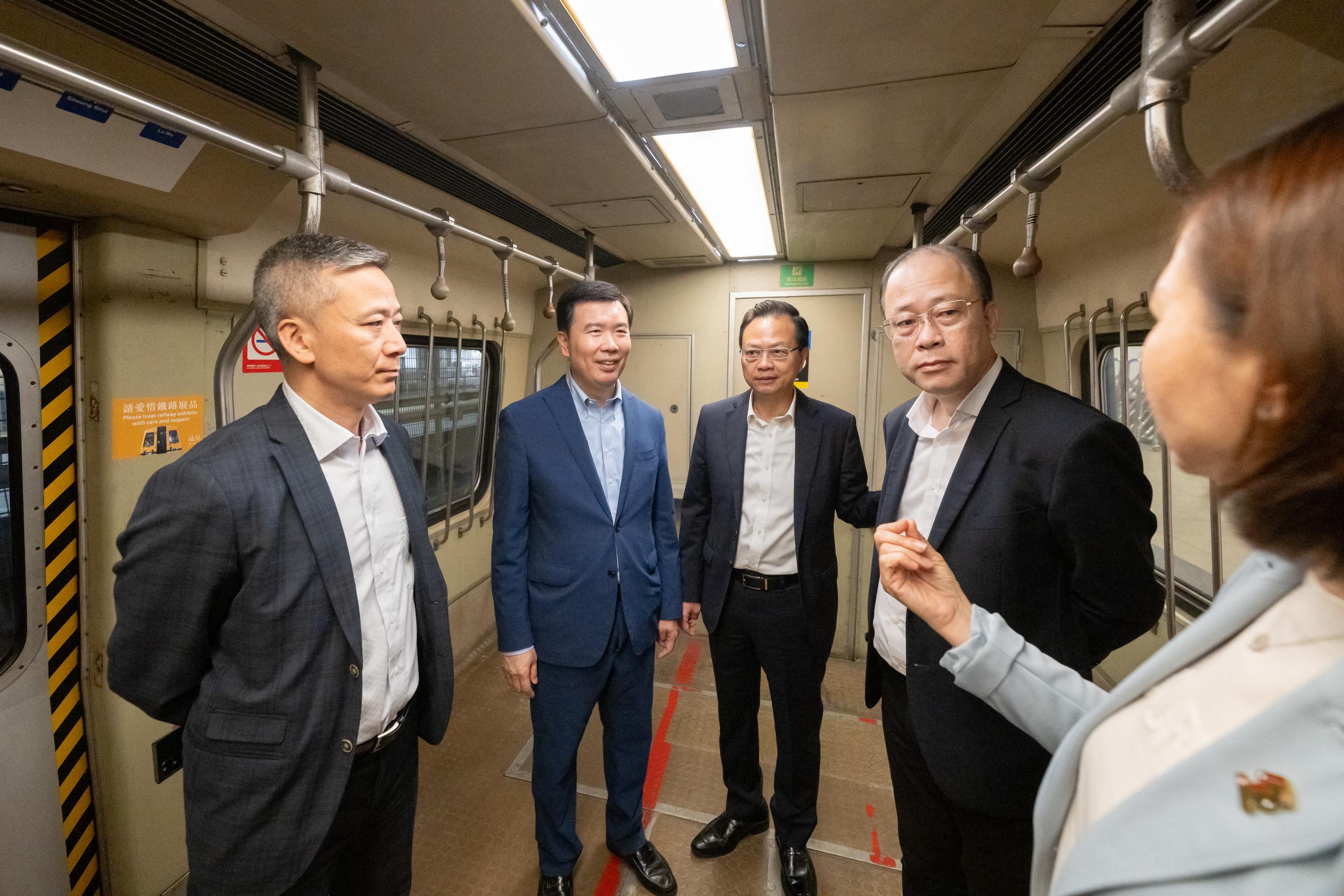 The Legislative Council (LegCo) Panel on Transport visited the "Station Rail Voyage" Exhibition of the MTR Corporation Limited at Hung Hom Station today (April 24).  Photo shows LegCo Members visiting the first-generation electric train "Yellow Head".