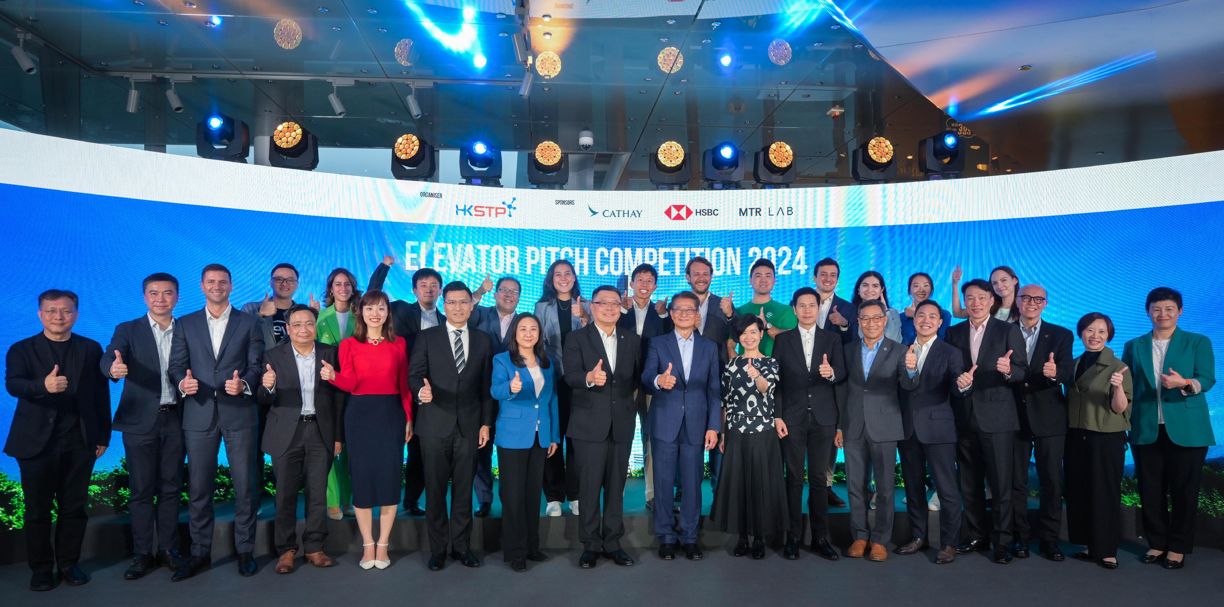 The Financial Secretary, Mr Paul Chan, attended the Elevator Pitch Competition 2024 today (April 26). Photo shows Mr Chan (front row, centre); the Secretary for Housing, Ms Winnie Ho (front row, eighth right); the Under Secretary for Innovation, Technology and Industry, Ms Lilian Cheong (front row, fifth left); the Chairman of the Hong Kong Science and Technology Parks Corporation (HKSTP), Dr Sunny Chai (front row, eighth left); the Chief Executive Officer of the HKSTP, Mr Albert Wong (front row, sixth right), and other guests and participants at the competition.
