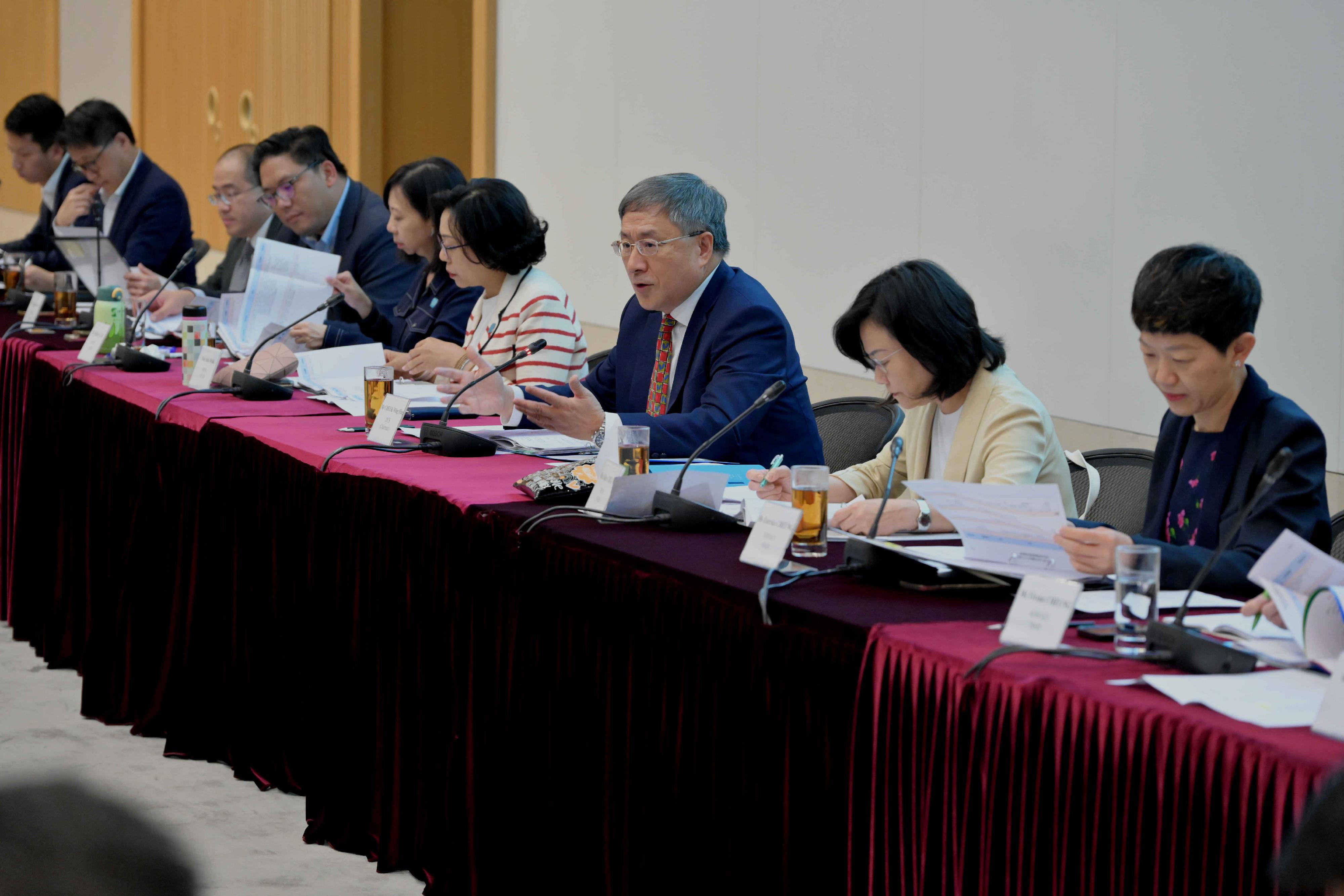 The Deputy Chief Secretary for Administration, Mr Cheuk Wing-hing (third right), chairs the fourth meeting of the Task Force on District Governance today (April 29) to review the preparatory work of various bureaux and departments for the celebration of the 75th anniversary of the founding of the People's Republic of China, and the implementation progress of seven district issues. Next to Mr Cheuk is the Secretary for Home and Youth Affairs, Miss Alice Mak (fourth right).