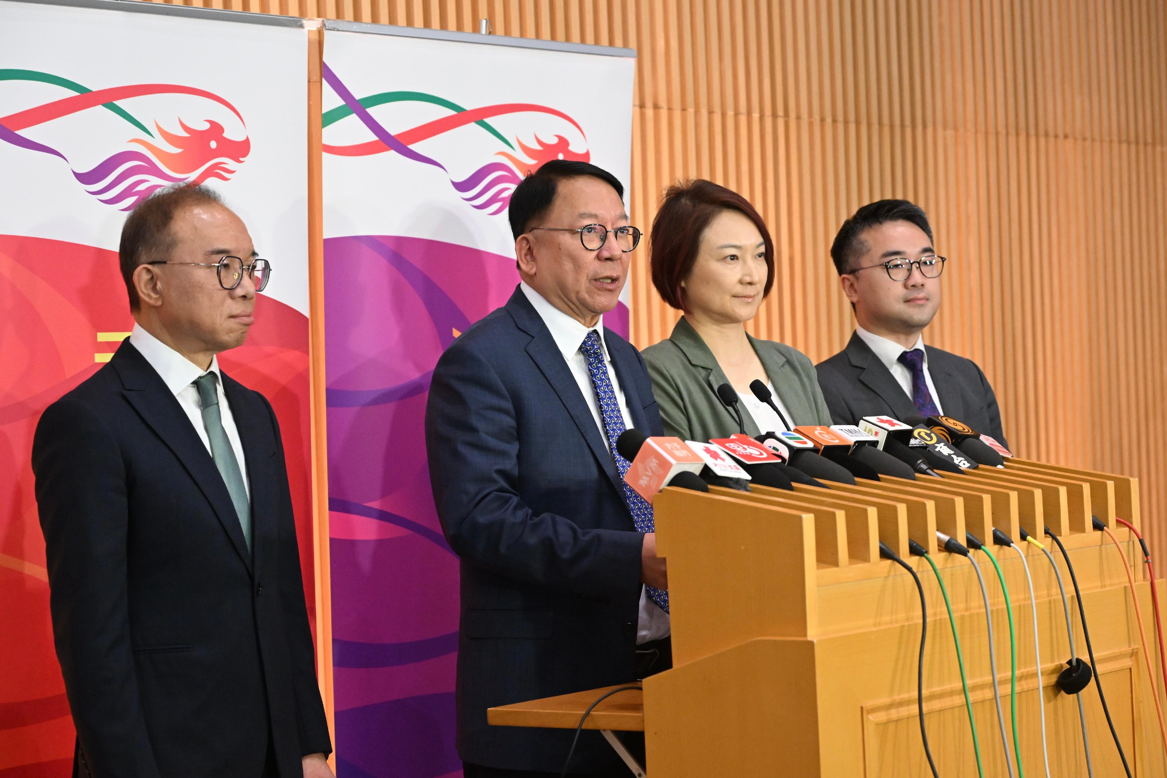The Chief Secretary for Administration, Mr Chan Kwok-ki (second left), together with the Convenor of the Working Group on Patriotic Education, Ms Starry Lee (second right); the Secretary for Constitutional and Mainland Affairs, Mr Erick Tsang Kwok-wai (first left); and the Acting Secretary for Education, Mr Sze Chun-fai (first right), meet the media after the first meeting of the Working Group on Patriotic Education under the Constitution and Basic Law Promotion Steering Committee this morning (April 29).
