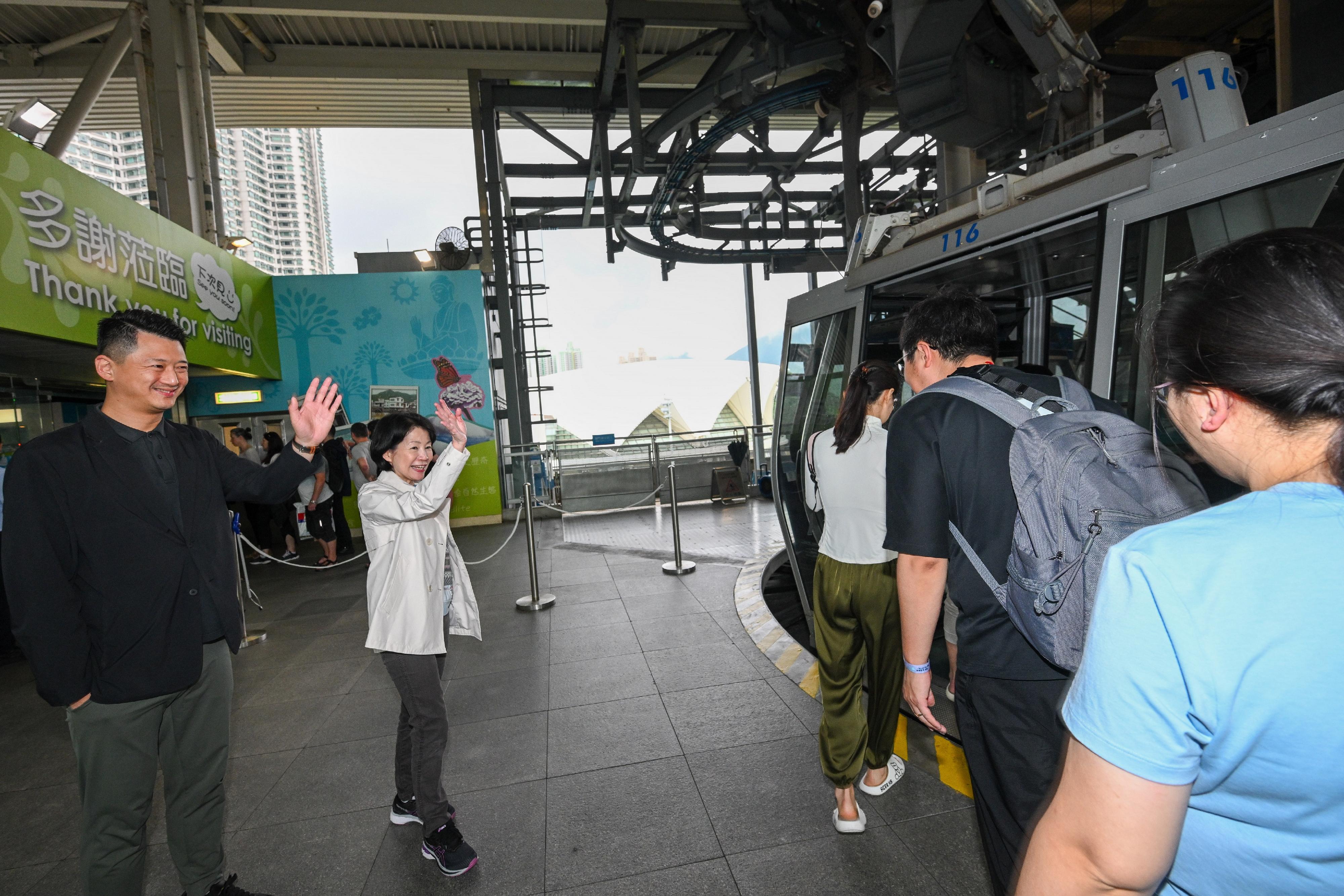 The Commissioner for Tourism, Ms Vivian Sum (second left), today (May 1) visited Ngong Ping 360 to monitor crowd management and tourist activities of the tourist attraction during the 2024 Labour Day Golden Week of the Mainland.