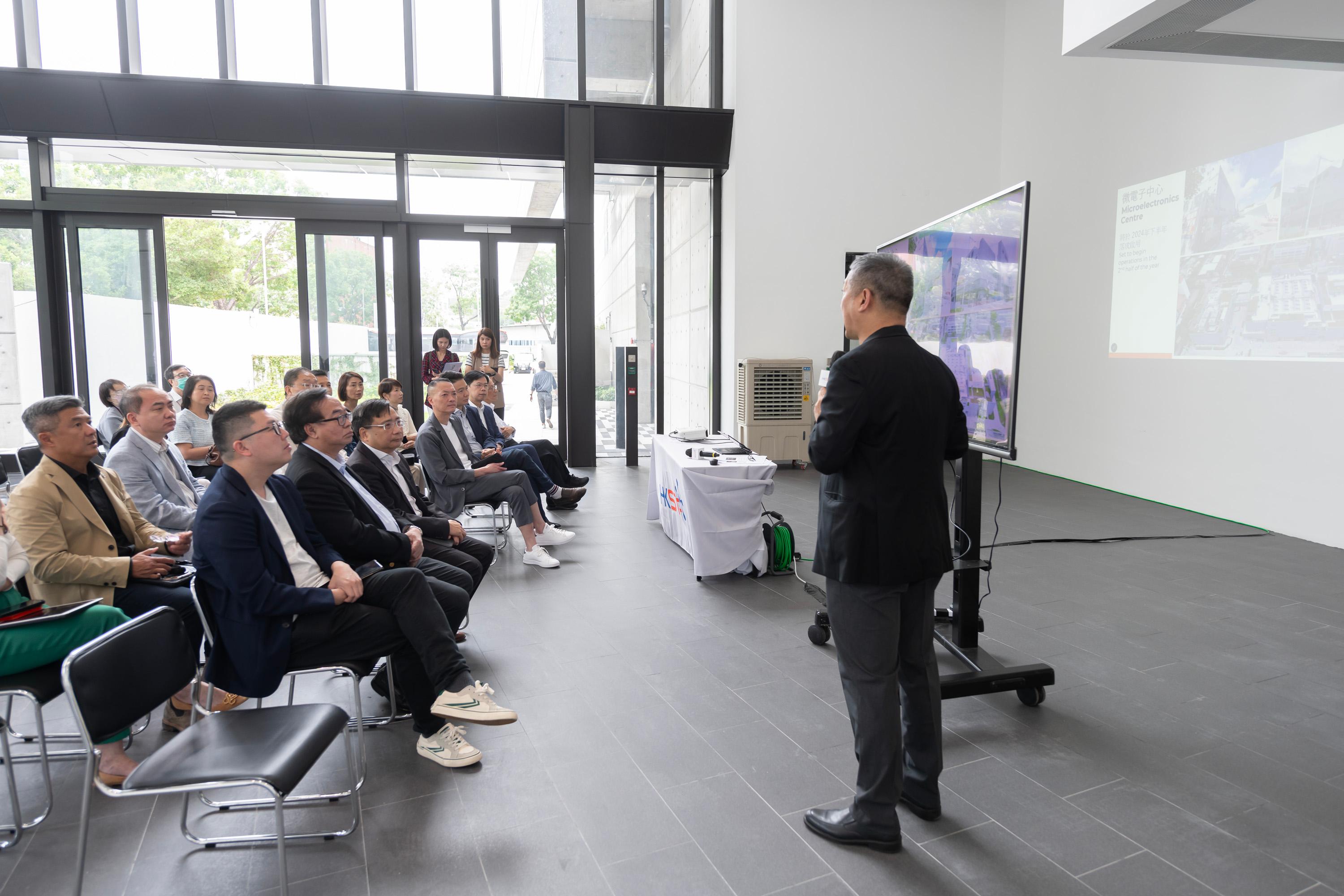 The Legislative Council (LegCo) Subcommittee on Matters Relating to the Promotion of New Industrialization visited the Microelectronics Centre at Yuen Long InnoPark today (May 10). Photo shows LegCo Members receiving a briefing on the latest development of the microelectronics innovations in Hong Kong.