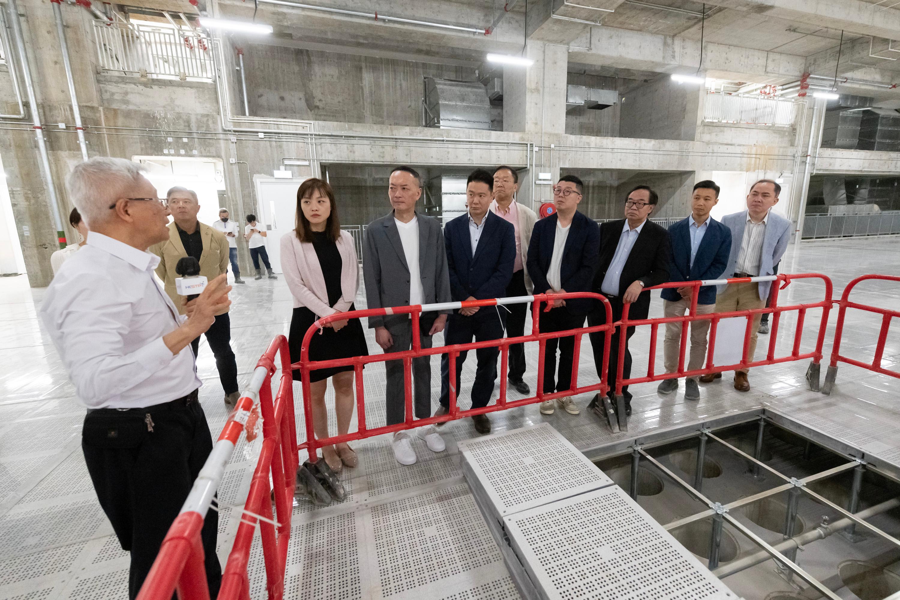 The Legislative Council (LegCo) Subcommittee on Matters Relating to the Promotion of New Industrialization visited the Microelectronics Centre (MEC) at Yuen Long InnoPark today (May 10). Photo shows LegCo Members touring the Full Fabrication Units in MEC.