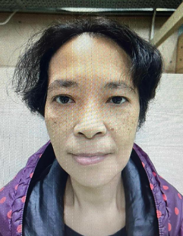 Lau Leung-ching, aged 56, is about 1.6 metres tall, 58 kilograms in weight and of medium build. She has a square face with yellow complexion and black hair in shoulder length. She was last seen wearing a dark blue jacket, a black shirt, black trousers, black and pink sport shoes and carrying a beige recycle bag.
