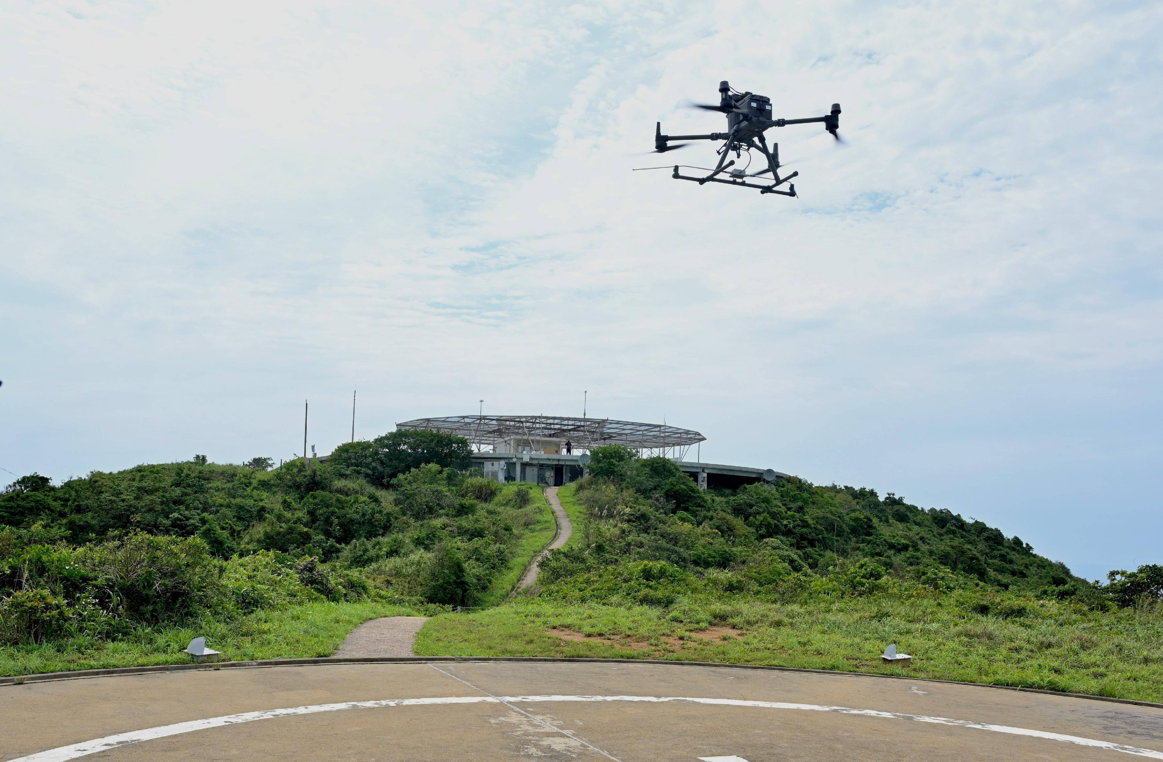 The Civil Aviation Department (CAD) today (May 13) conducted the second phase of a trial flight inspection by small unmanned aircraft (SUA) at the CAD Outstation on Tung Lung Island. Photo shows the SUA of the trial inspecting the signals emitting from the Doppler Very High Frequency Omnidirectional Radio Range and Distance Measuring Equipment.