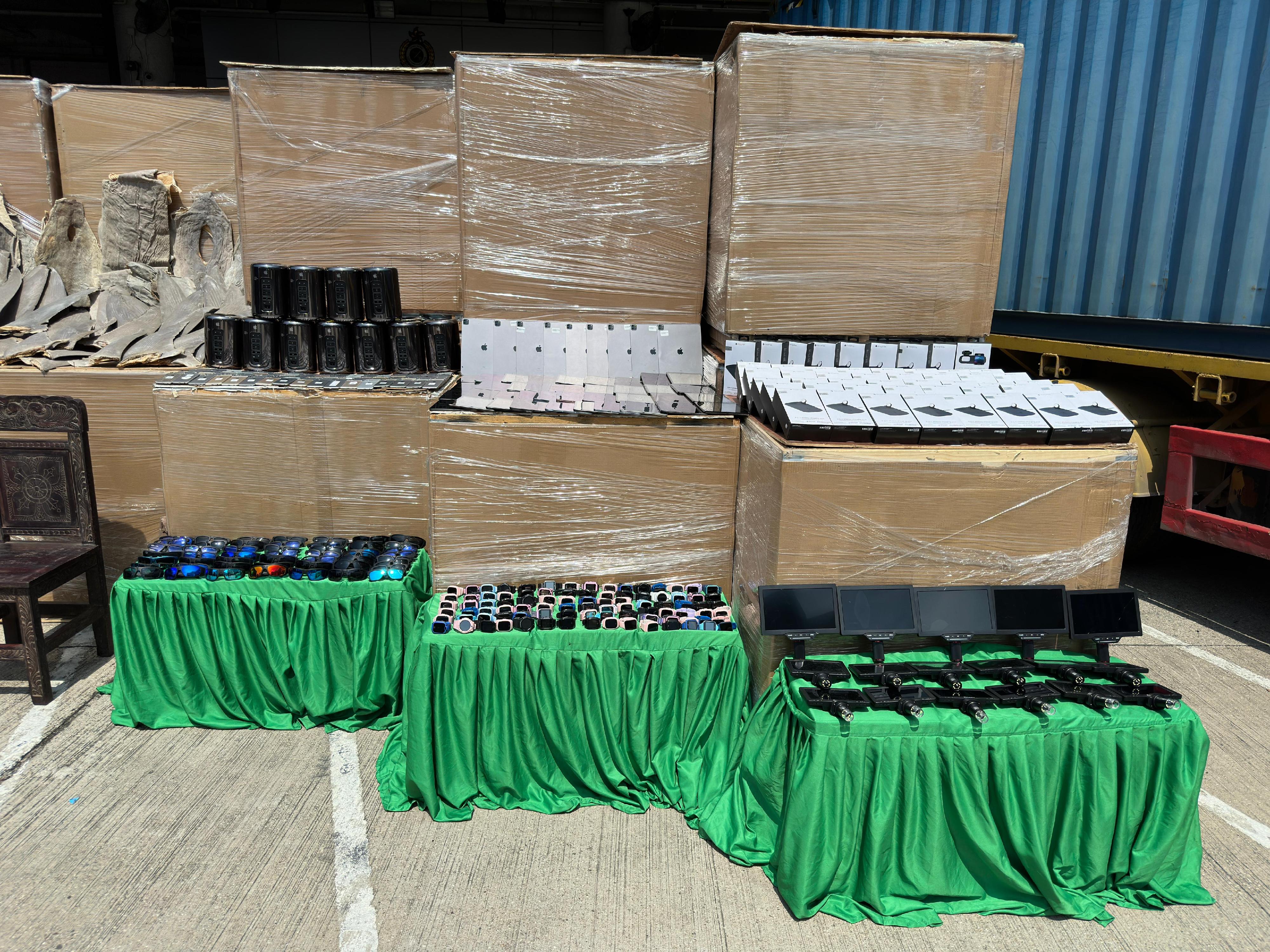 Hong Kong Customs on May 7 detected a suspected case of using an ocean-going vessel to smuggle goods to Taiwan at the Kwai Chung Container Terminals. A large batch of unmanifested goods, including suspected scheduled dried shark fins and skins, suspected scheduled wood furniture, electronic components and electronic products, with an estimated market value of about $160 million was seized inside two containers. Photo shows some of the suspected smuggled electronic components and electronic products seized.