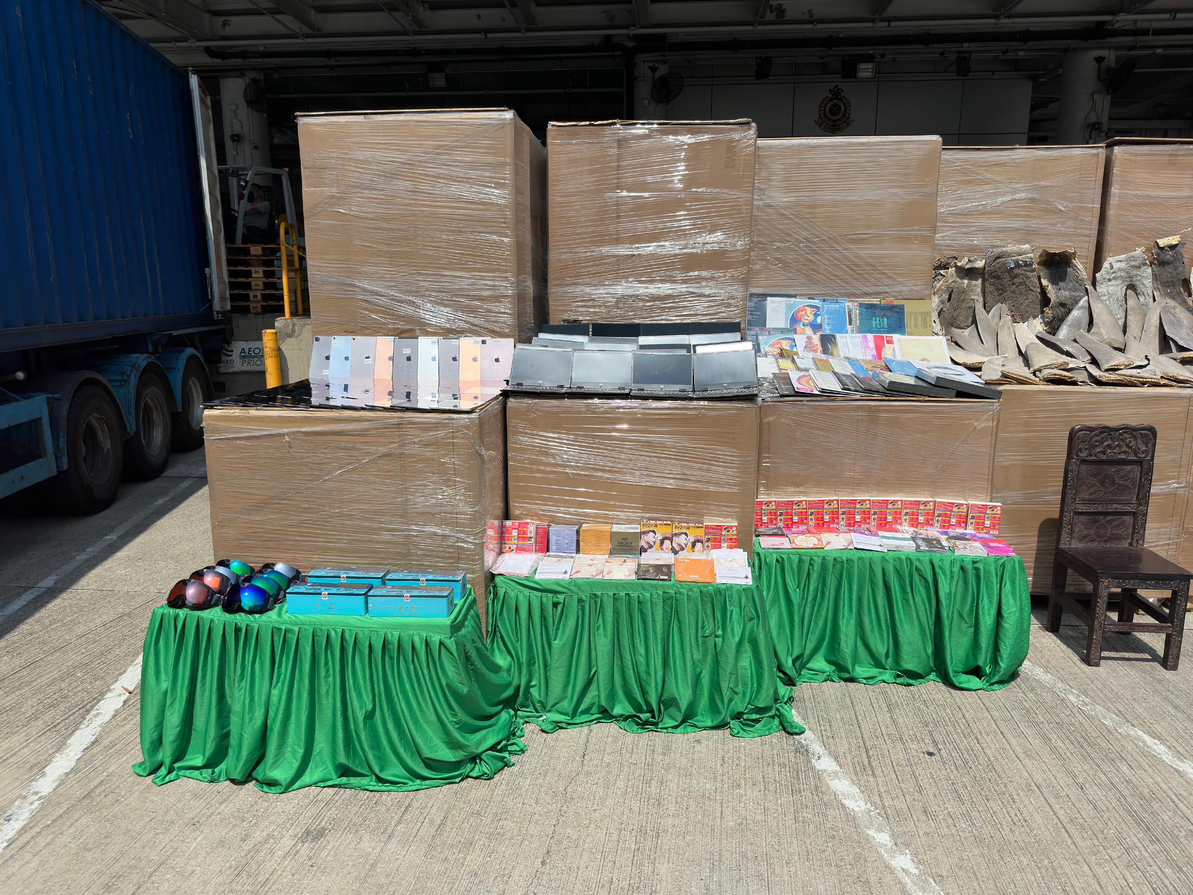 Hong Kong Customs on May 7 detected a suspected case of using an ocean-going vessel to smuggle goods to Taiwan at the Kwai Chung Container Terminals. A large batch of unmanifested goods, including suspected scheduled dried shark fins and skins, suspected scheduled wood furniture, electronic components and electronic products, with an estimated market value of about $160 million was seized inside two containers. Photo shows some of the suspected smuggled electronic products and music records seized.