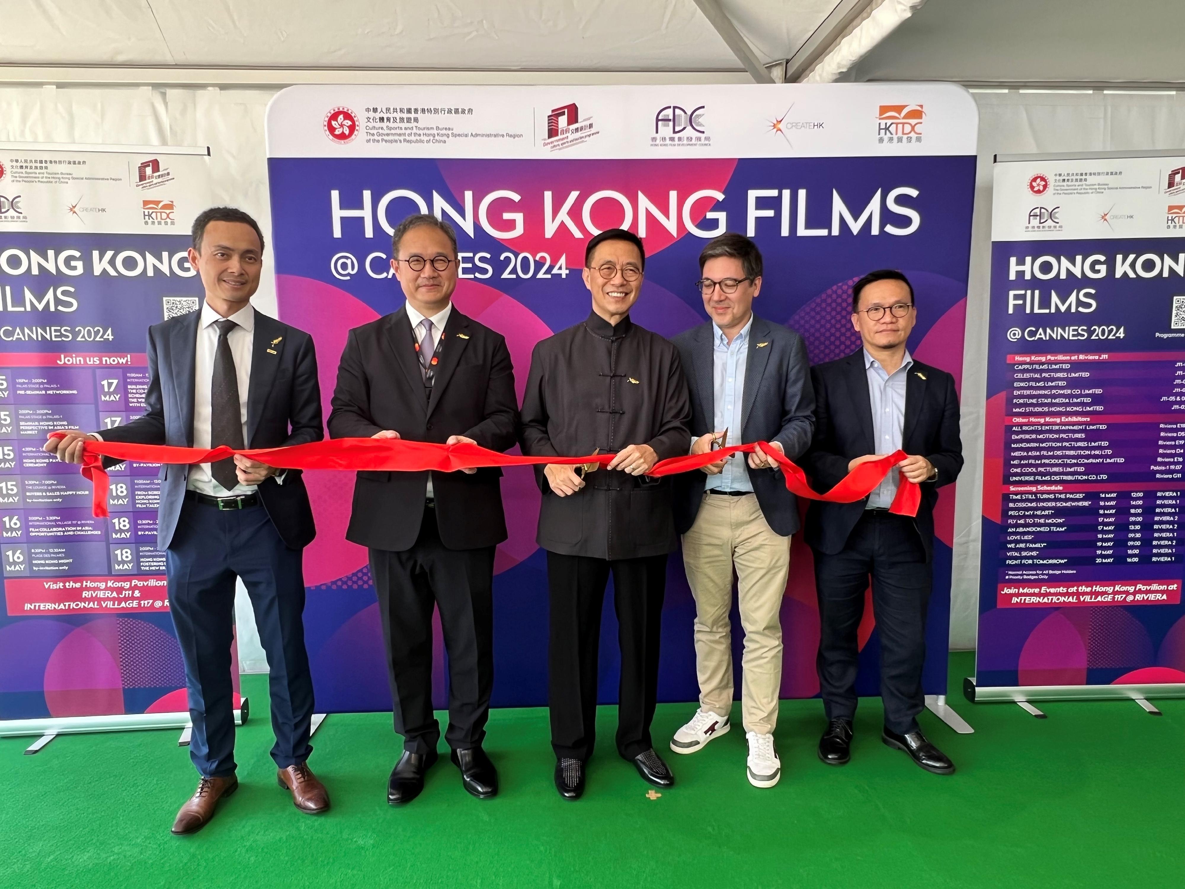 The Secretary for Culture, Sports and Tourism, Mr Kevin Yeung, led a Hong Kong film industry delegation to the 77th Cannes Film Festival in France. On May 15 (Cannes time), Mr Yeung (centre) officiated at the opening ceremony of the Hong Kong Pavilion at the Cannes Film Market. The Permanent Secretary for Culture, Sports and Tourism, Mr Joe Wong (second left), and Assistant Head of Create Hong Kong Mr Gary Mak (first right), also attended.