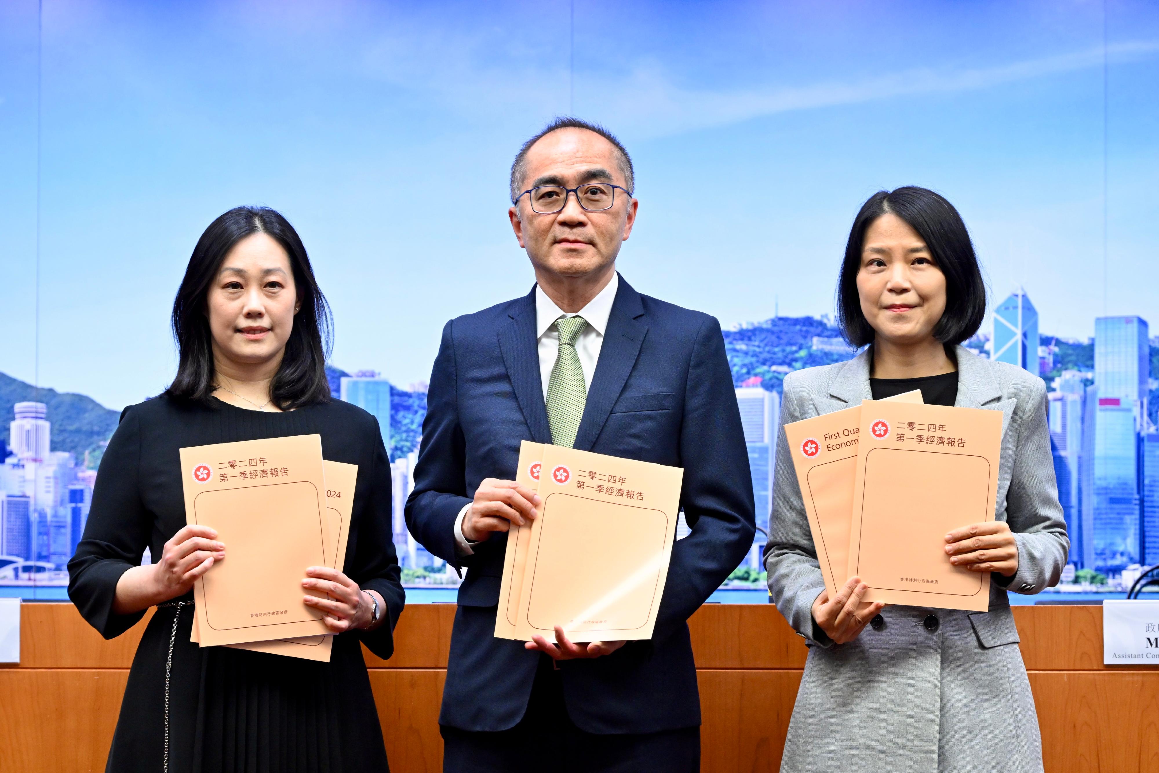 The Government Economist, Mr Adolph Leung (centre), presents the First Quarter Economic Report 2024 at a press conference today (May 17). Also present are Principal Economist Ms Joyce Cheung (left) and Assistant Commissioner for Census and Statistics Ms Edith Chan (right).