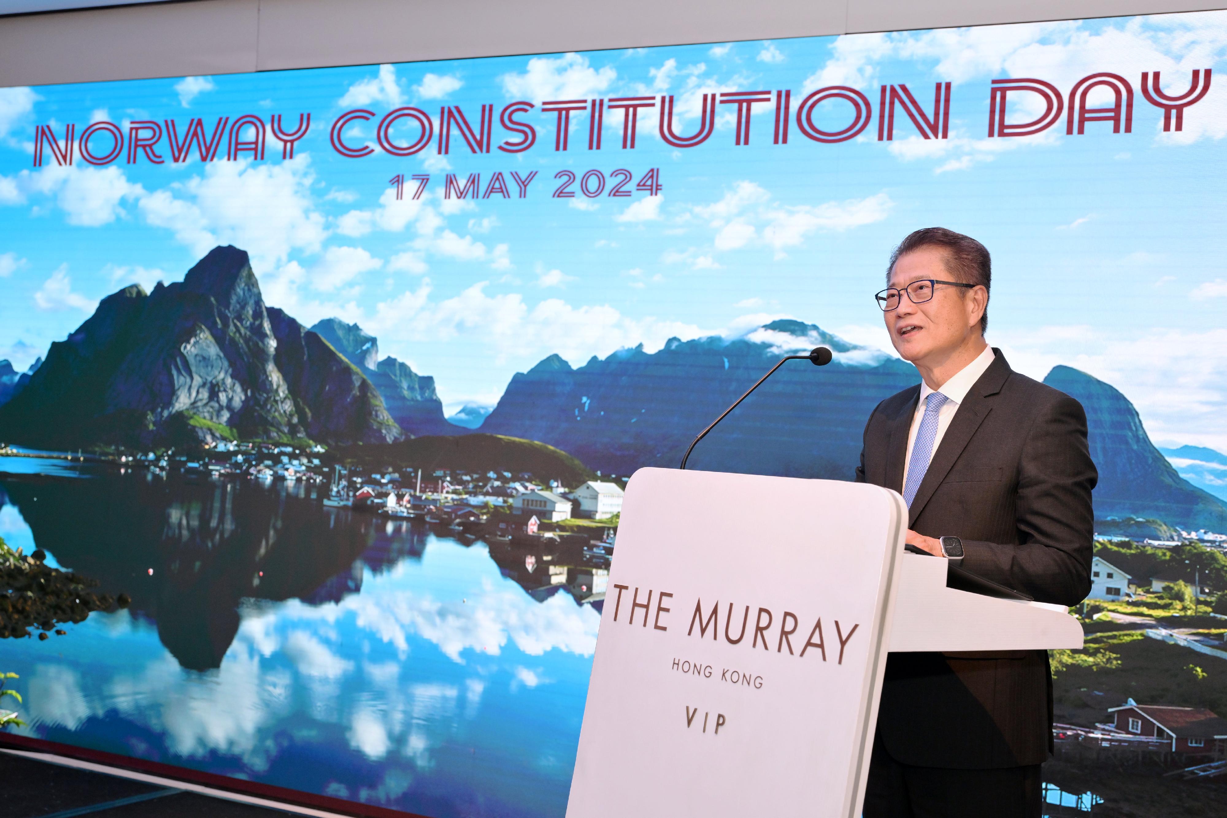 The Financial Secretary, Mr Paul Chan, speaks at the cocktail reception of the Constitution Day of Norway today (May 17). 