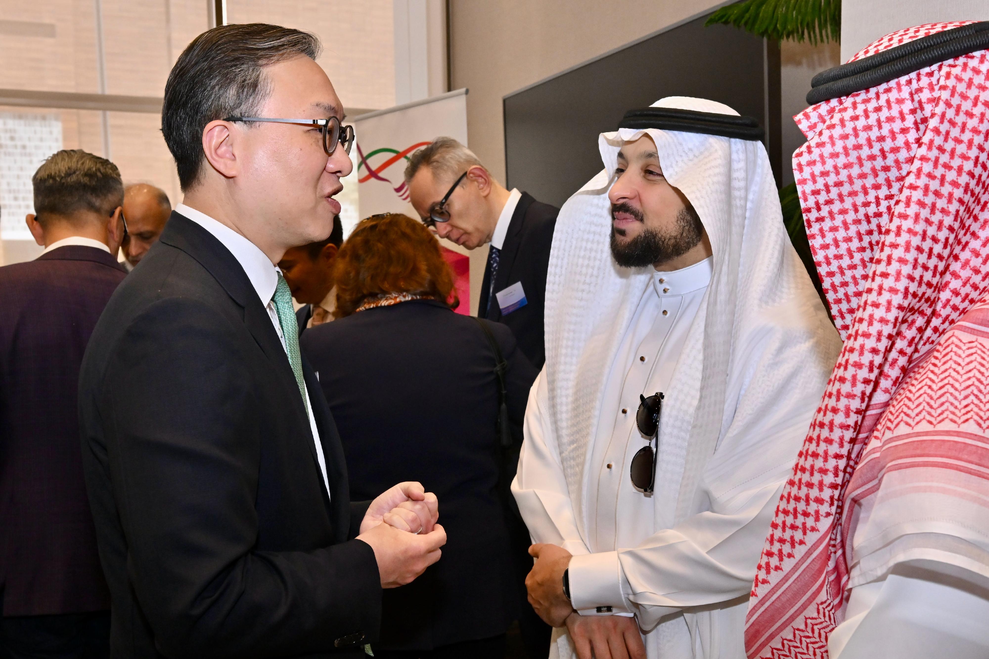 The Secretary for Justice, Mr Paul Lam, SC, arrived in Riyadh, Saudi Arabia, today (May 19, Riyadh time) with his about 30-person delegation, comprising representatives from the Law Society of Hong Kong, the Hong Kong Bar Association, the Hong Kong Exchanges and Clearing Limited, Invest Hong Kong and related sectors, and began a two-day visit to the city. Photo shows Mr Lam (left) chatting with the Chief Executive Officer of the Saudi Center for Commercial Arbitration, Dr Hamed Merah (right), at a lunch and networking reception titled "Hong Kong – The Common Law Gateway for Saudi Arabia Businesses to China and Beyond", co-organised by the Department of Justice, the Hong Kong Economic and Trade Office in Dubai, the Hong Kong Trade Development Council and the Saudi Chinese Business Council, and supported by Invest Hong Kong.