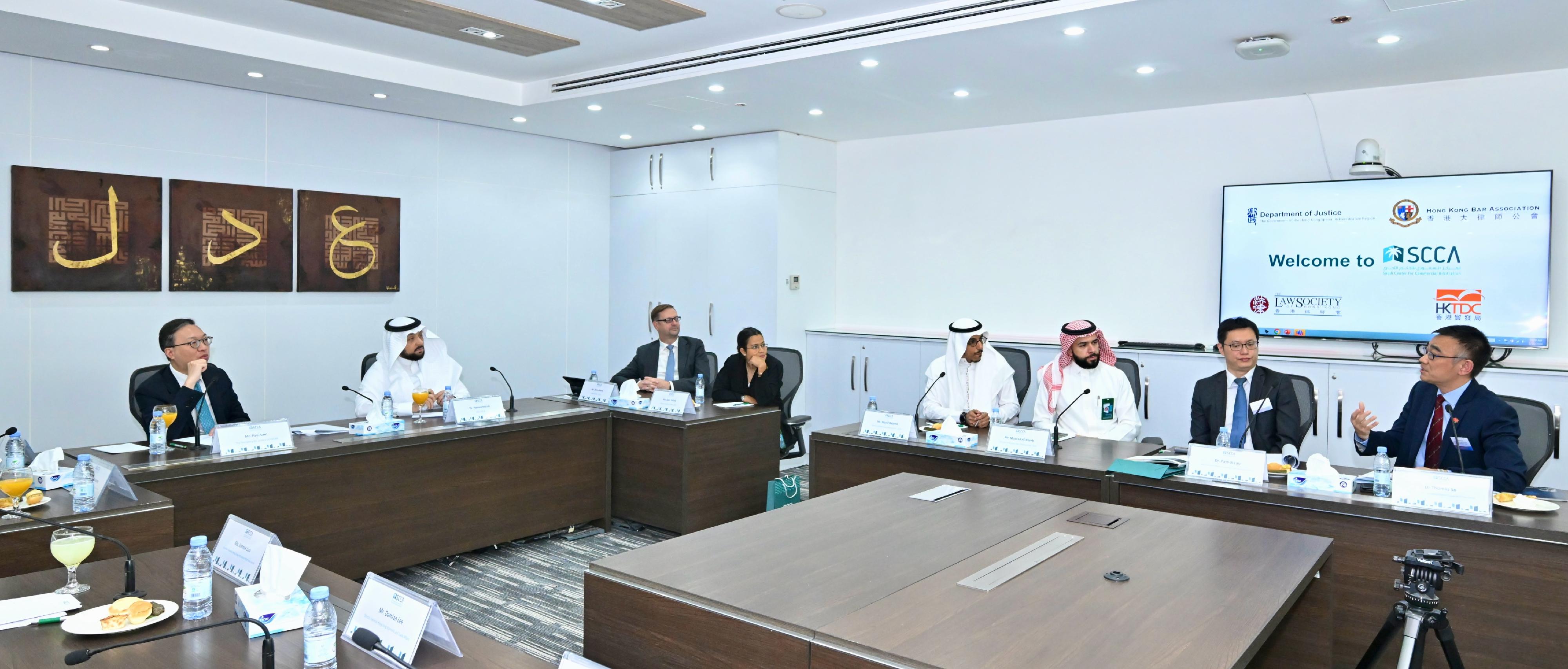 The Secretary for Justice, Mr Paul Lam, SC, continued his visit to Riyadh, Saudi Arabia, today (May 20, Riyadh time) with his about 30-person delegation, comprising representatives from the Law Society of Hong Kong, the Hong Kong Bar Association, the Hong Kong Exchanges and Clearing Limited, Invest Hong Kong and related sectors. Photo shows Mr Lam (first left) and his delegation meeting with the Chief Executive Officer of the Saudi Center for Commercial Arbitration (SCCA), Dr Hamed Merah (second left), and the board of directors of the SCCA.
