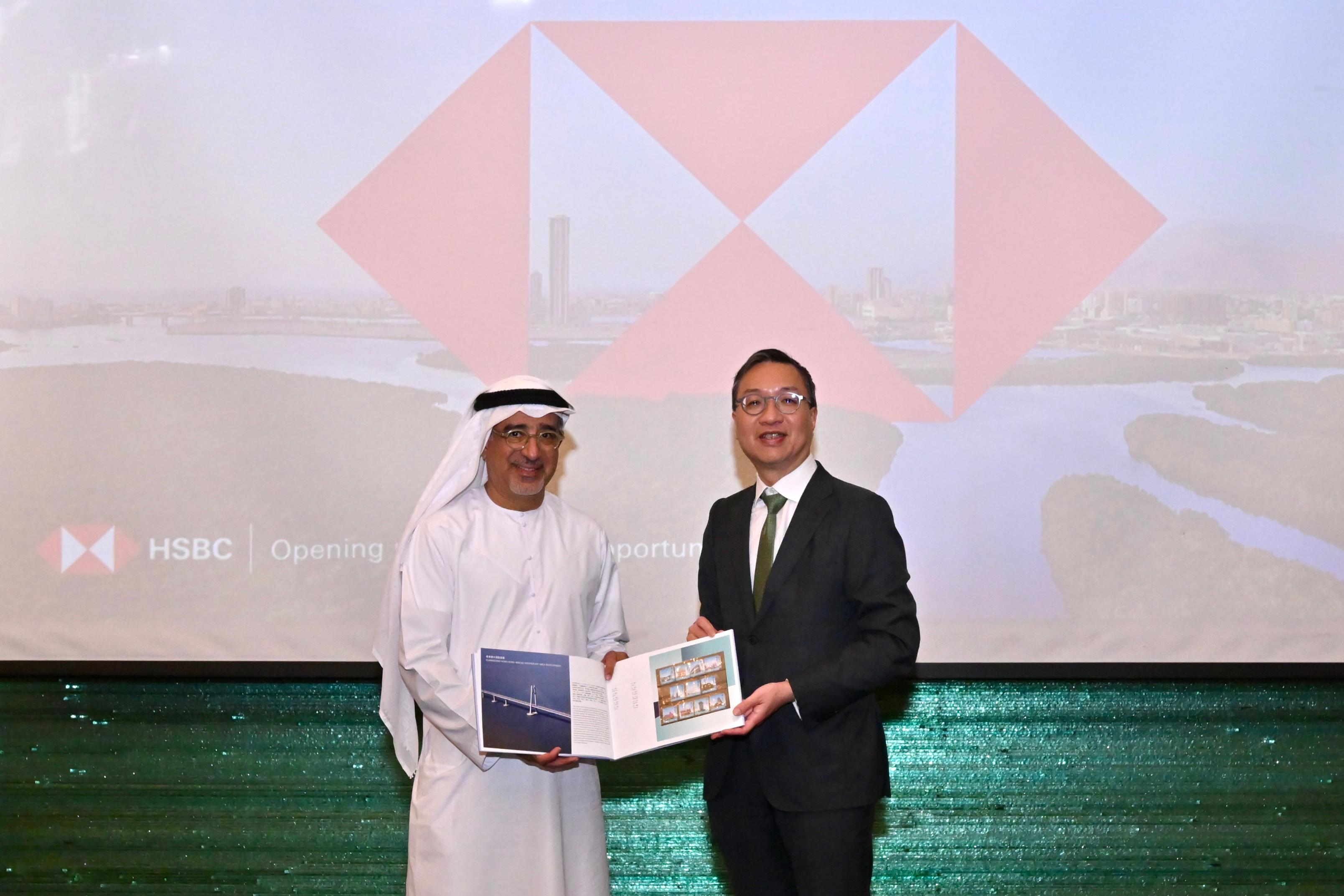 The Secretary for Justice, Mr Paul Lam, SC, started his visit programme to Abu Dhabi, the United Arab Emirates, today (May 21, Abu Dhabi time) with his about 30-strong delegation, comprising representatives from the Law Society of Hong Kong, the Hong Kong Bar Association, the Hong Kong Exchanges and Clearing Limited, Invest Hong Kong and related sectors. Photo shows Mr Lam (right) presenting a souvenir to the Chairman of the Board of HSBC Bank Middle East, Mr Abdulfattah Sharaf (left).

