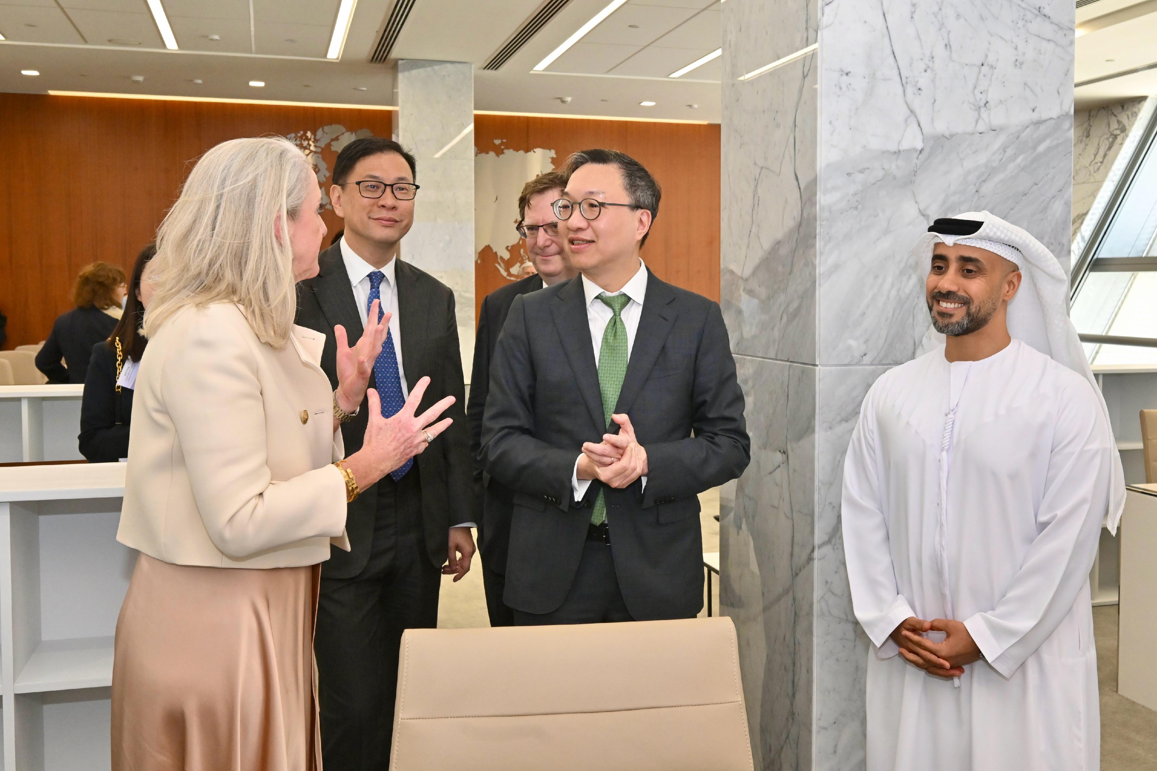 The Secretary for Justice, Mr Paul Lam, SC, started his visit programme to Abu Dhabi, the United Arab Emirates, today (May 21, Abu Dhabi time) with his about 30-strong delegation, comprising representatives from the Law Society of Hong Kong, the Hong Kong Bar Association, the Hong Kong Exchanges and Clearing Limited, Invest Hong Kong and related sectors. Photo shows Mr Lam (second right) and his delegation exchanging views with the Registrar and Chief Executive of Abu Dhabi Global Market (ADGM) Courts, Ms Linda Fitz-Alan (first left), and the Chief Executive Officer of ADGM Authority, Mr Salem Mohammed Al Darei (first right).
