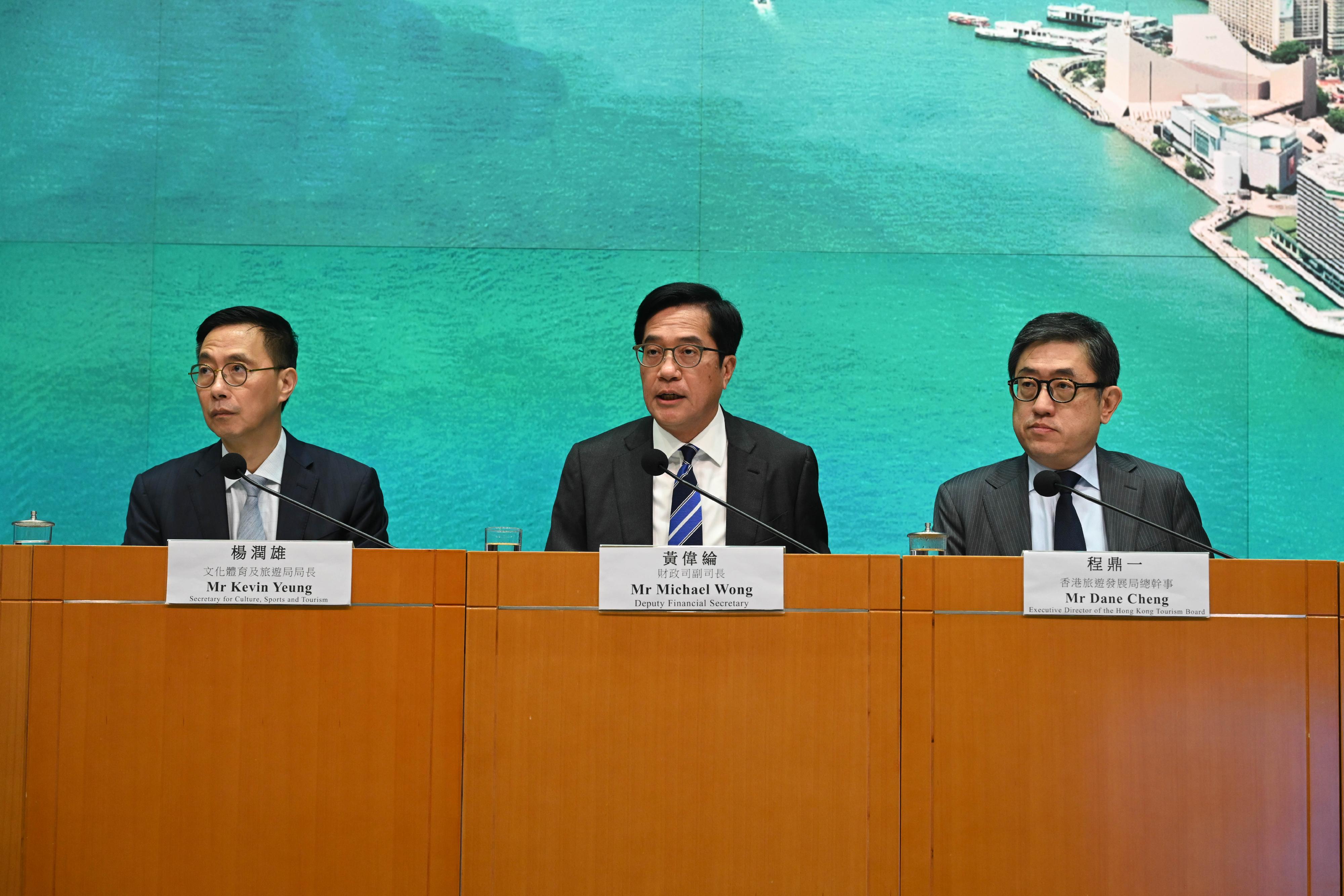 The Deputy Financial Secretary, Mr Michael Wong (centre), is joined by the Secretary for Culture, Sports and Tourism, Mr Kevin Yeung (left), and the Executive Director of the Hong Kong Tourism Board, Mr Dane Cheng (right), at a press conference today (May 21) to announce the calendar of mega events in Hong Kong (second half of 2024).

