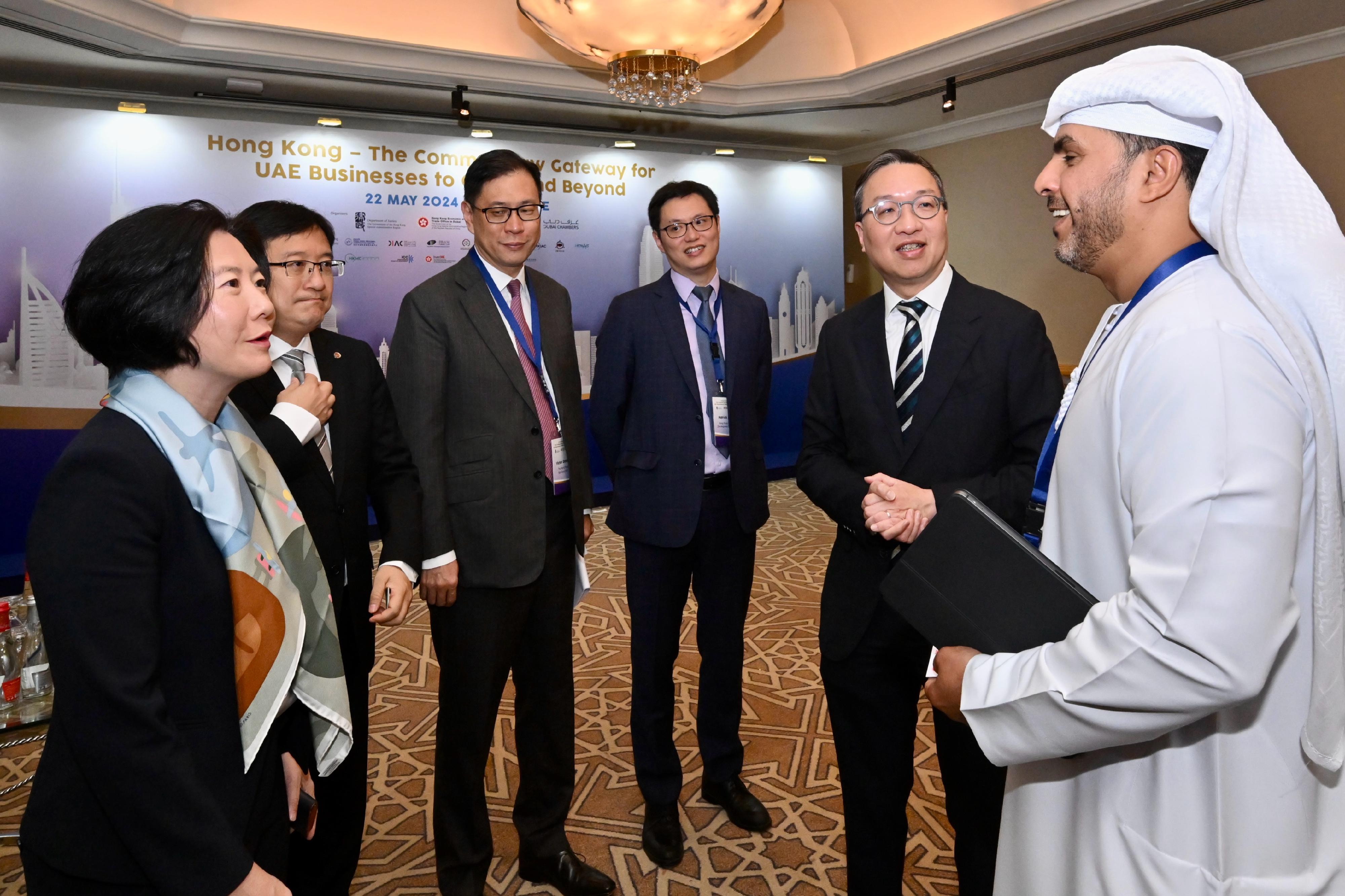 The Secretary for Justice, Mr Paul Lam, SC, continued his visit to Dubai, the United Arab Emirates (UAE), today (May 22, Dubai time) to attend a forum titled Hong Kong - The Common Law Gateway for UAE Businesses to China and Beyond for promoting Hong Kong's legal and dispute resolution services. Photo shows (from second right) Mr Lam; Deputy Executive Director of the Hong Kong Trade Development Council Dr Patrick Lau; the Chairman of the Hong Kong Bar Association, Mr Victor Dawes, SC; the President of the Law Society of Hong Kong, Mr Chan Chak-ming; and the Director-General of Investment Promotion, Ms Alpha Lau, exchanging views with the Minister of Justice of the UAE, Mr Abdullah bin Sultan bin Awad Al Nuaimi (first right).

