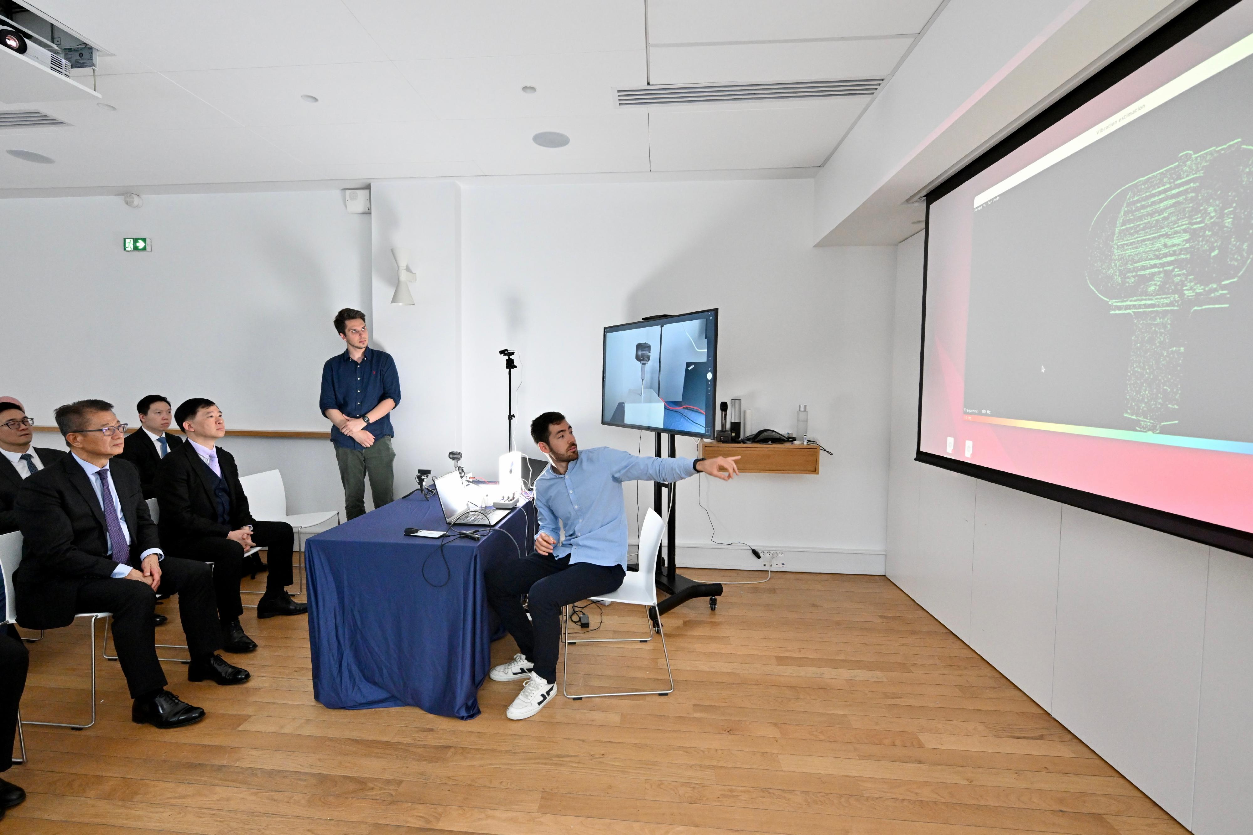 The Financial Secretary, Mr Paul Chan, started his itinerary shortly after arriving in Paris, France, yesterday morning (May 23, Paris time). Photo shows Mr Chan (first left) visiting a French company, Prophesee, which specialises in sensor chips, and listening to presentation by the company's executives on their technology and business development.