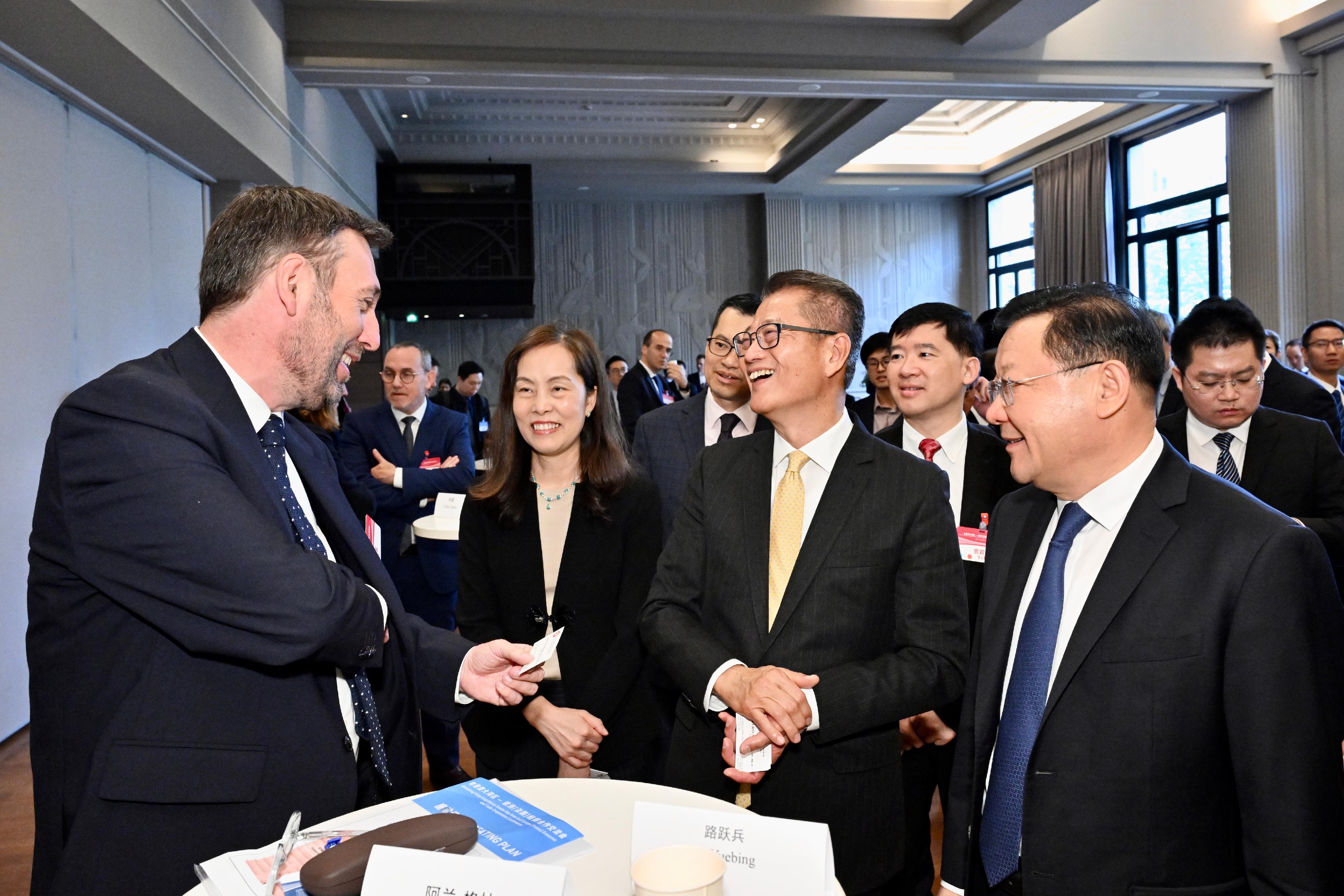 The Financial Secretary, Mr Paul Chan, attended the Guangdong-Hong Kong-Macao Greater Bay Area and Europe (France) Economic and Trade Cooperation Conference in Paris, France today (May 24, Paris time). Photo shows Mr Chan (second right); the Governor of Guangdong Province, Mr Wang Weizhong (first right); the Secretary for Social Affairs and Culture of the Macao Special Administrative Region, Ms Ao Ieong U (second left) exchanging views with guests from the French commercial and industrial sector before the Conference.