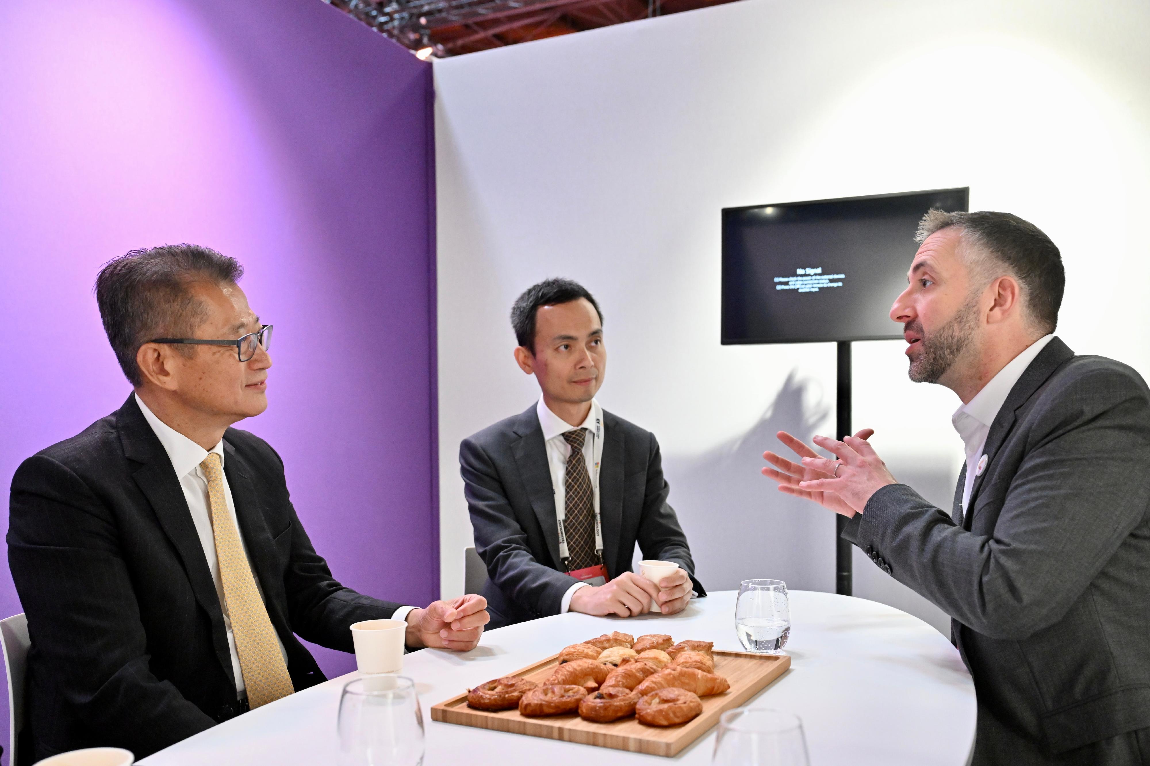 The Financial Secretary, Mr Paul Chan, visited VivaTech 2024, Europe's largest annual technology and startup event, yesterday (May 24, Paris Time). Photo shows Mr Chan (left) meeting with the senior management of VivaTech.
