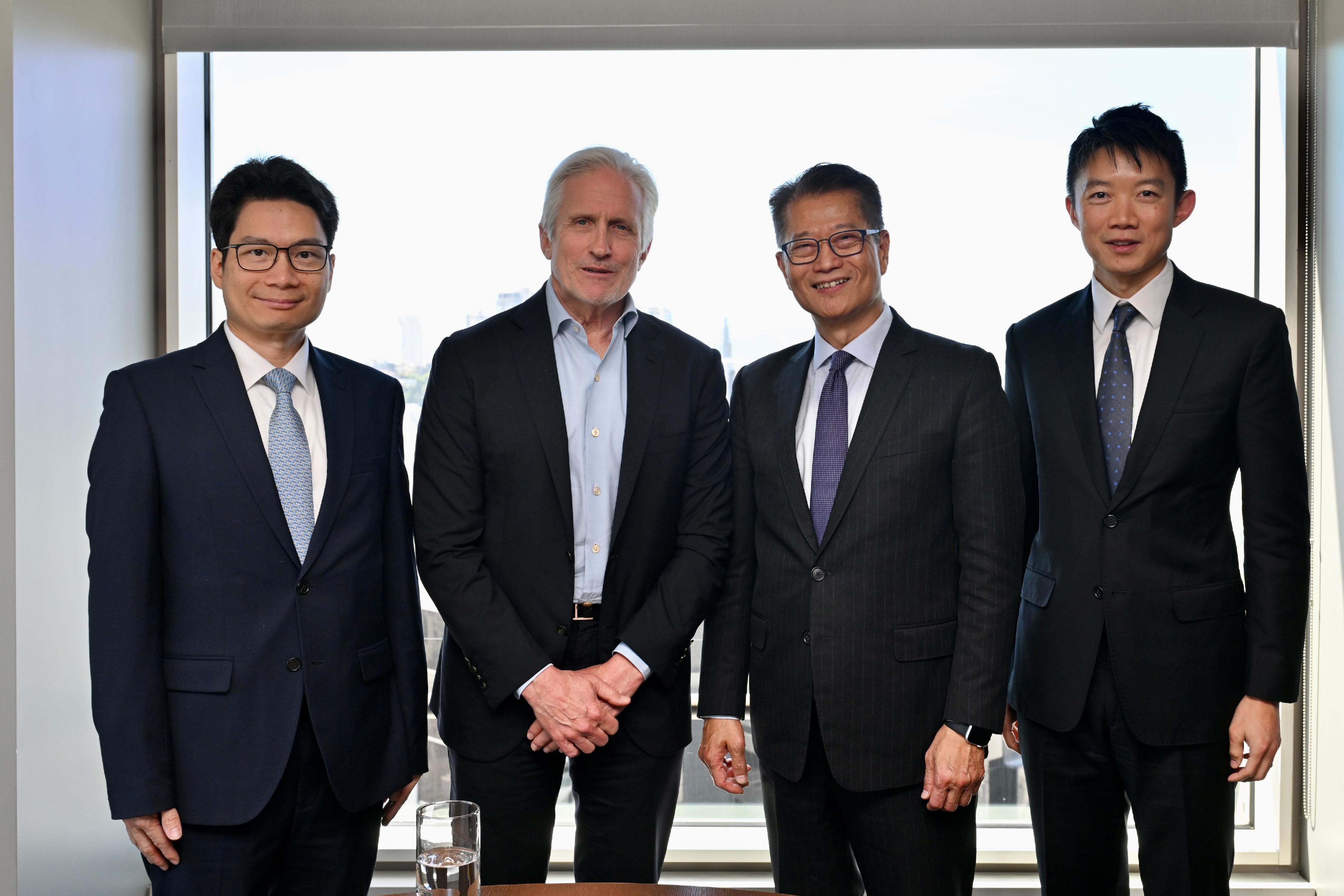 The Financial Secretary, Mr Paul Chan, began his visit to the United States on May 28 (San Francisco time), and visited an alternative asset management company, TPG, to meet with the Founder and Executive Chairman, Mr Jim Coulter. Photo shows Mr Chan (second right), accompanied by the Under Secretary for Financial Services and the Treasury, Mr Joseph Chan (first left) and Executive Director of the Hong Kong Monetary Authority Mr Kenneth Hui (first right) and Mr Coulter (second left).
