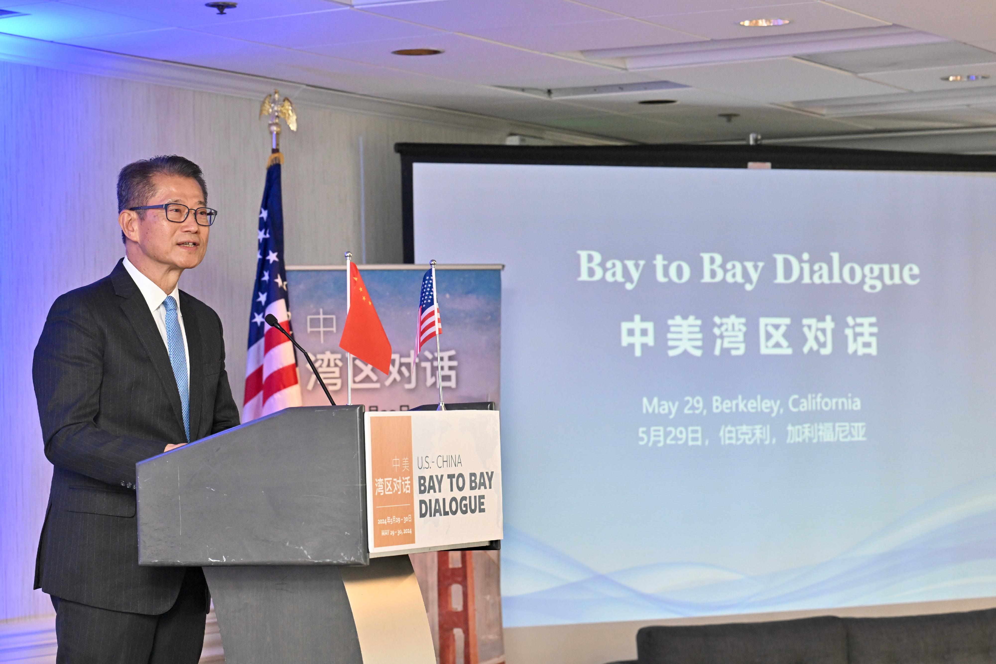 The Financial Secretary, Mr Paul Chan, leads a delegation from the Hong Kong Special Administrative Region Government to attend the Bay to Bay Dialogue between the California Bay Area and the Guangdong-Hong Kong-Macao Greater Bay Area in Berkeley in California, the United States on May 29 (California time). Photo shows Mr Chan delivering a speech at its High-level Remarks and Announcement session.