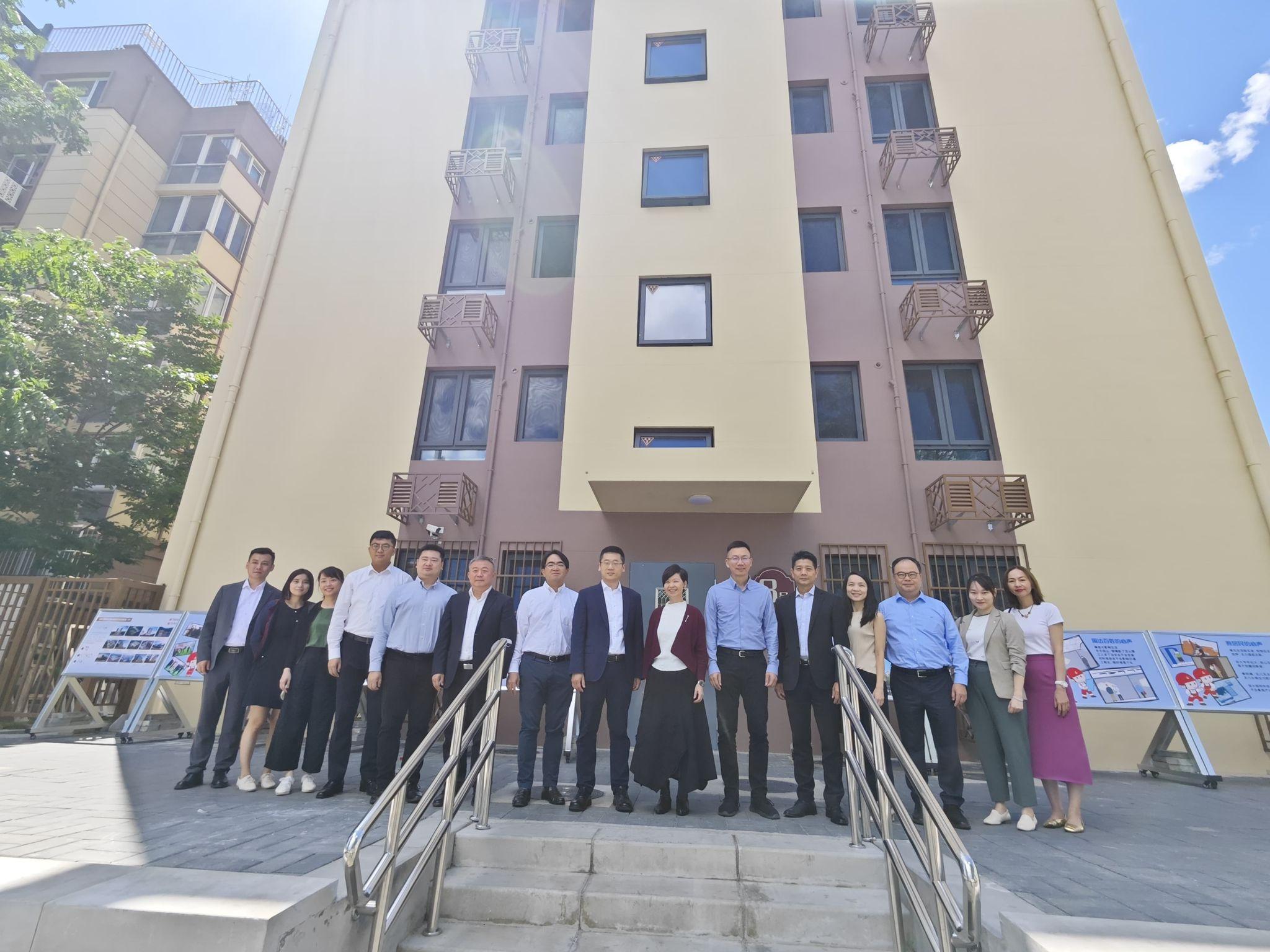 The Secretary for Housing, Ms Winnie Ho, departed Hangzhou and arrived in Beijing yesterday (May 30) to continue her visit. Photo shows Ms Ho (seventh right) and her delegation visiting an in-situ redevelopment project of an old building in Beijing this morning (May 31). The project was undertaken by the China State Construction International Holdings Limited and is the first building in the city adopting Modular Integrated Construction (MiC) as a concrete construction approach.