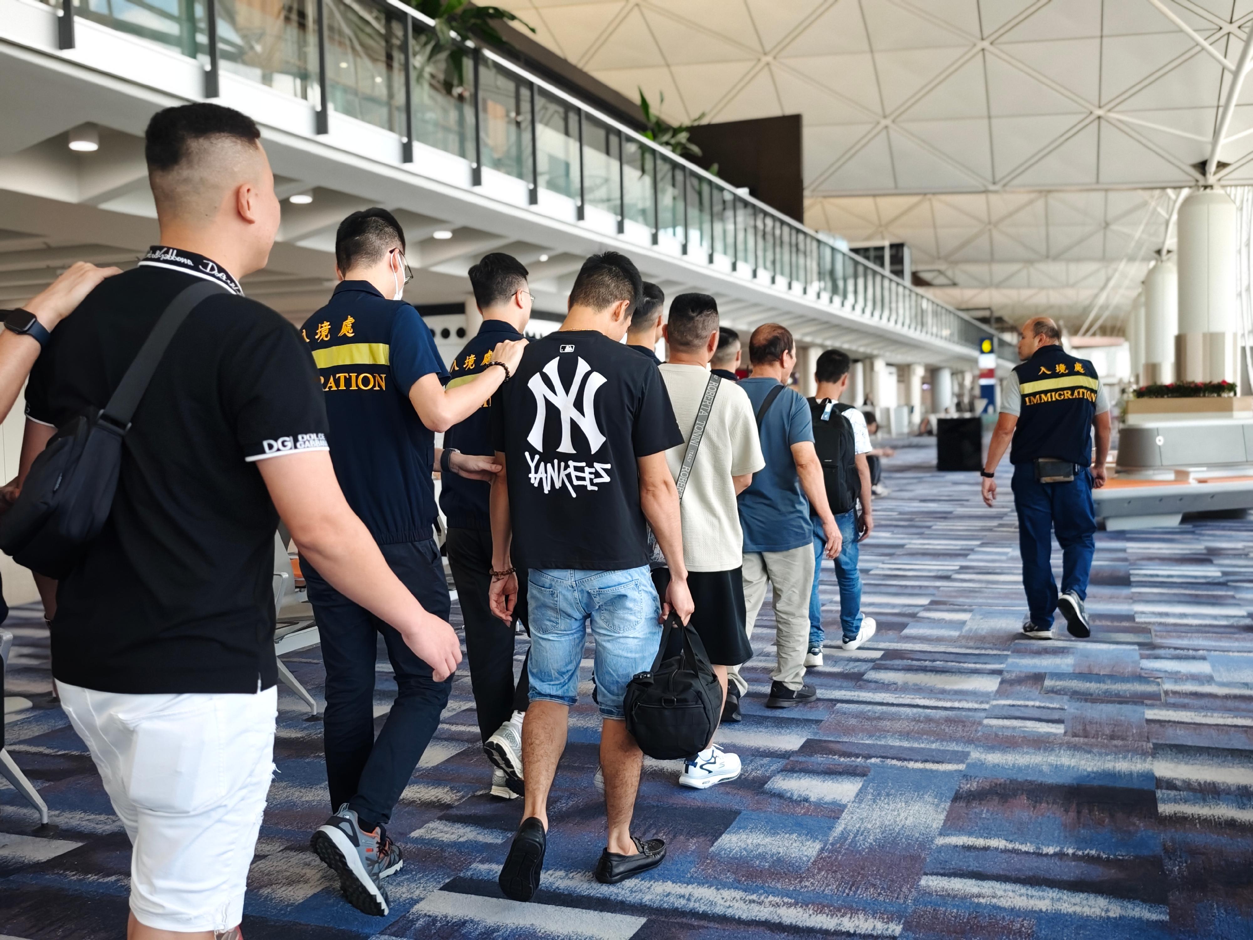 The Immigration Department (ImmD) carried out repatriation operations from May 29 to today (May 31). A total of 55 unsubstantiated non-refoulement claimants were repatriated to their places of origin. Photo shows removees being escorted by ImmD officers to depart from Hong Kong.