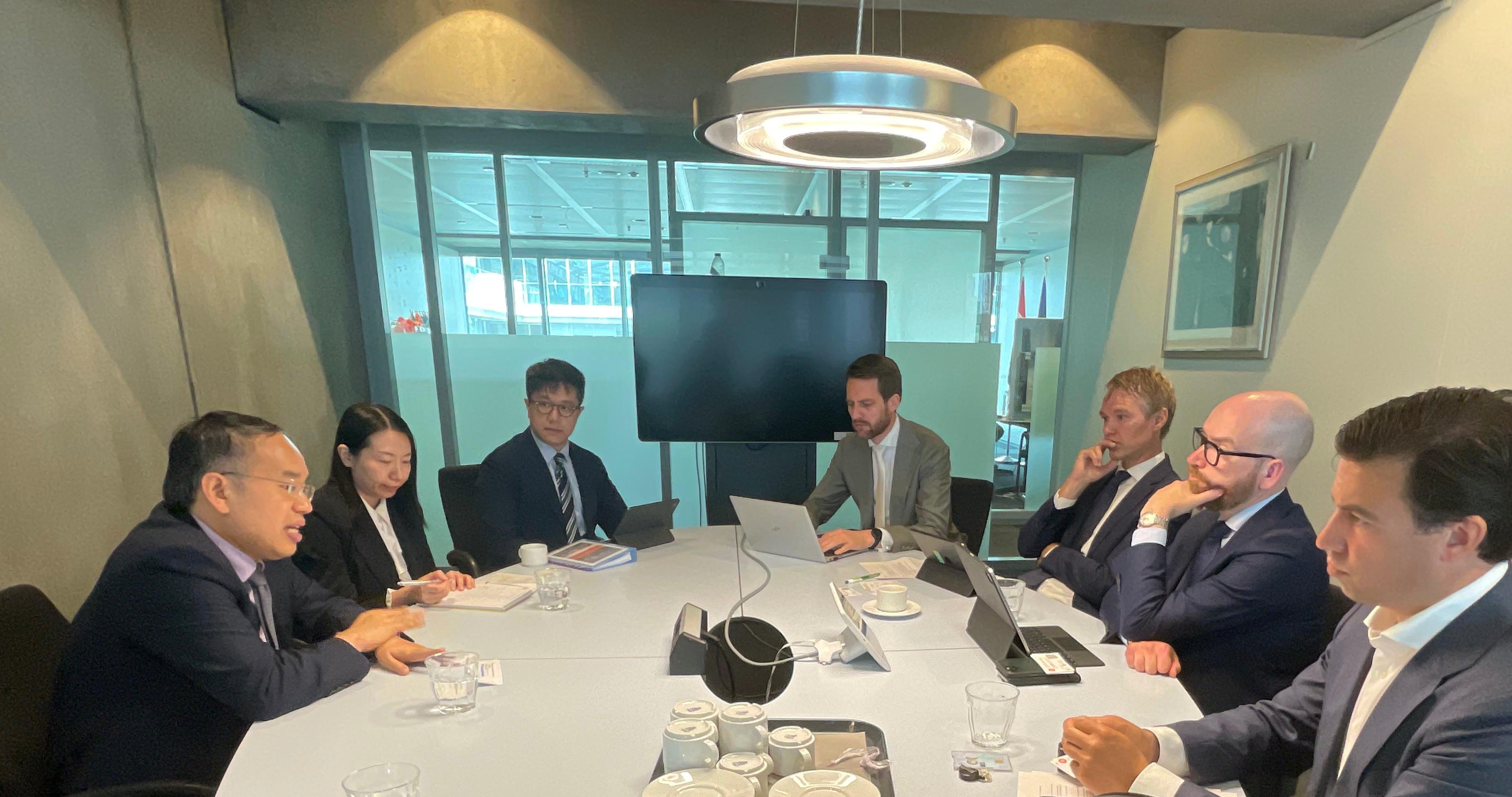 The Secretary for Financial Services and the Treasury, Mr Christopher Hui, is promoting Hong Kong's Web3 ecosystem and meeting senior financial officials in the Netherlands. Photo shows Mr Hui (first left) meeting with Deputy Treasurer-General and Director Financial Markets, Ministry of Finance of the Netherlands, Mr Joost Smits (second right), in the Hague on June 3 (the Hague time).