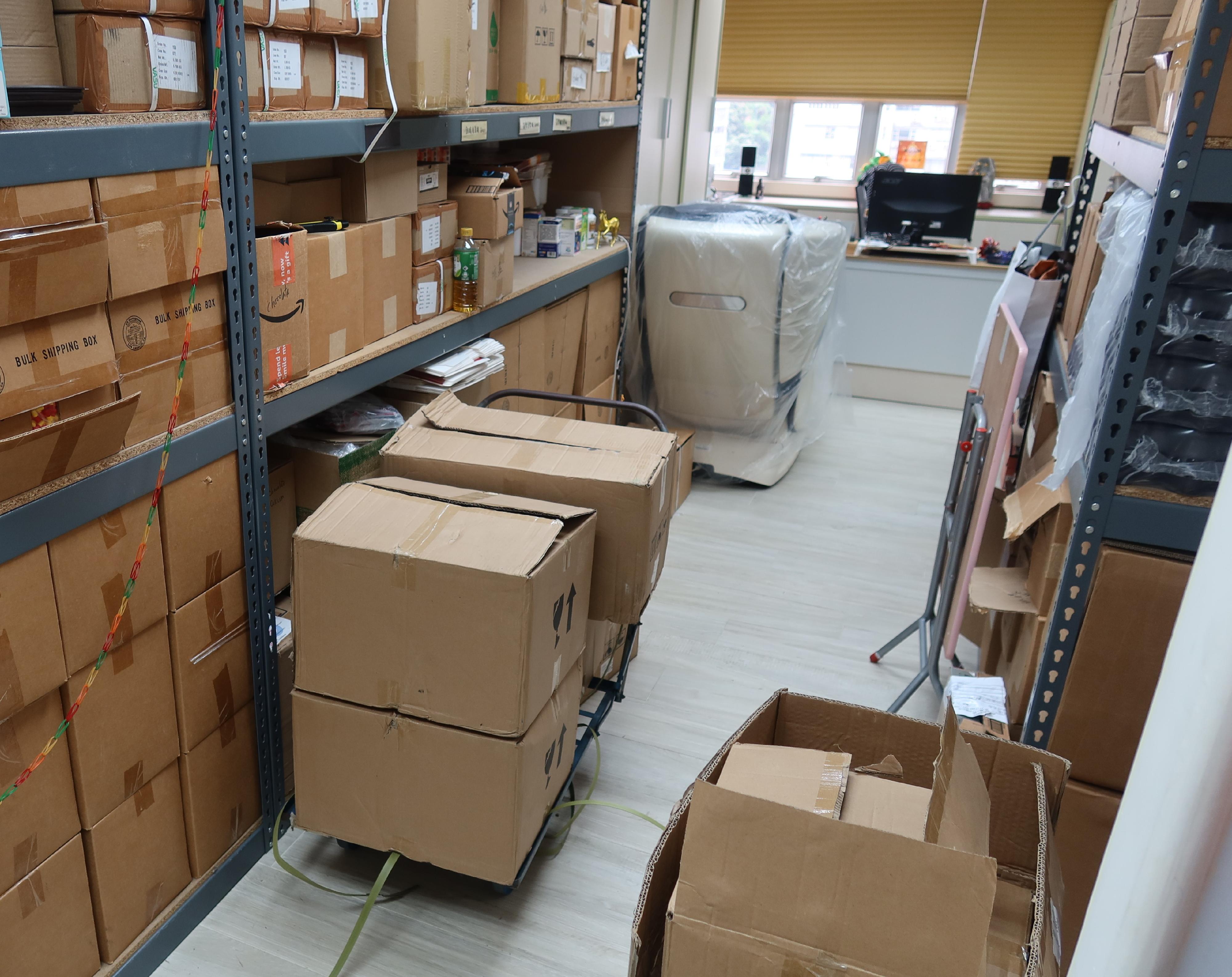 Hong Kong Customs conducted a special operation in Mong Kok and Fo Tan yesterday (June 4) to combat the sale of counterfeit goods and seized about 5 000 items of suspected counterfeit goods with an estimated market value of about $620,000. Photo shows a storage facility that stores suspected counterfeit goods raided by Customs officers.