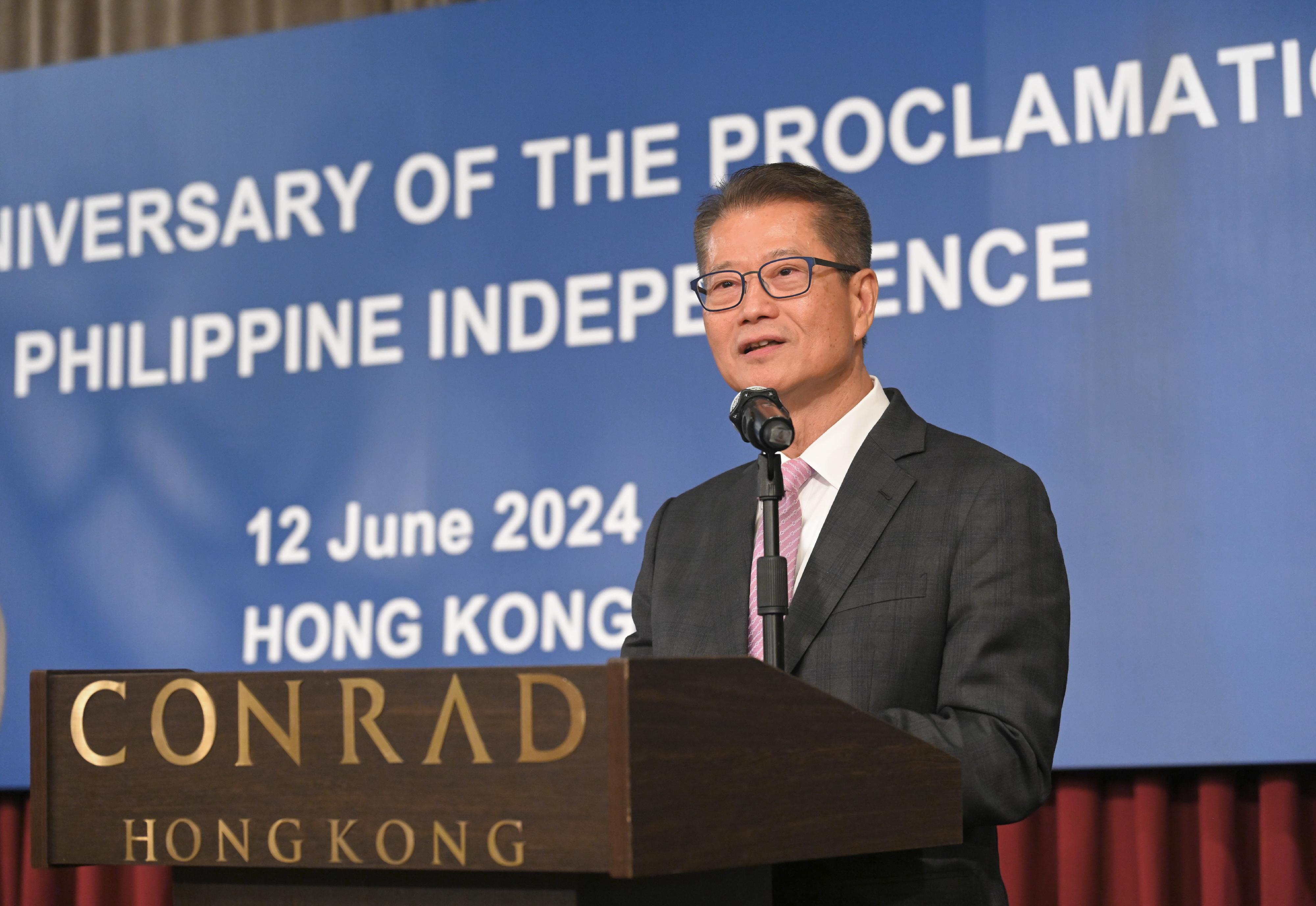 The Financial Secretary, Mr Paul Chan, speaks at the Reception in Celebration of 126th Anniversary of Proclamation of Philippine Independence today (June 12).