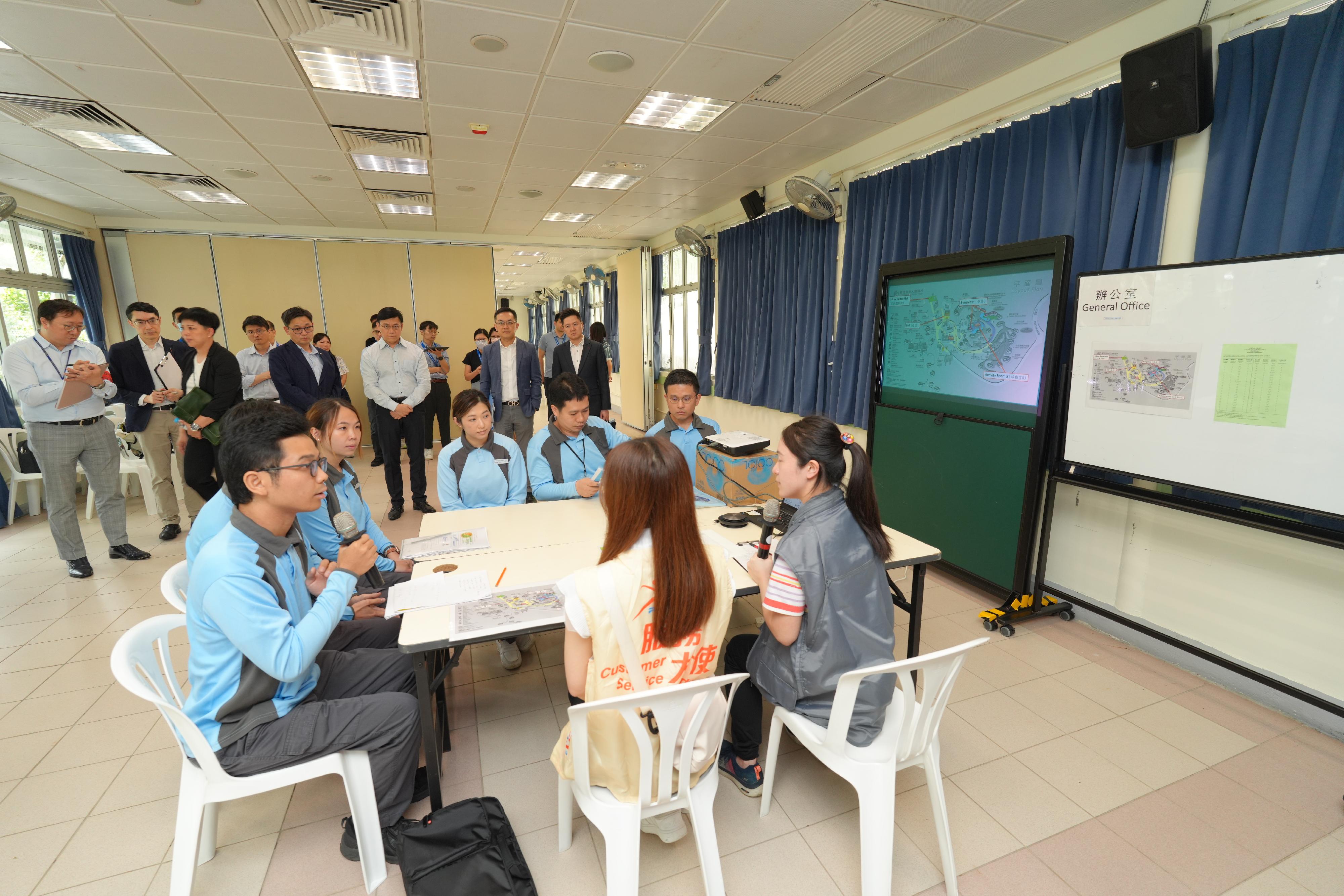  The Centre for Health Protection (CHP) of the Department of Health (DH) today (June 13) held a public health exercise code-named "Kyanite" to test and strengthen the preparedness and co-ordination abilities of the Government in handling an imported case of measles, with a view to enhancing awareness among stakeholders on the handling of public health emergencies. Photo shows the Director of Health, Dr Ronald Lam (back row, second right), and the Controller of the CHP of the DH, Dr Edwin Tsui (back row, first right), observing officers of the CHP conducting a site visit.