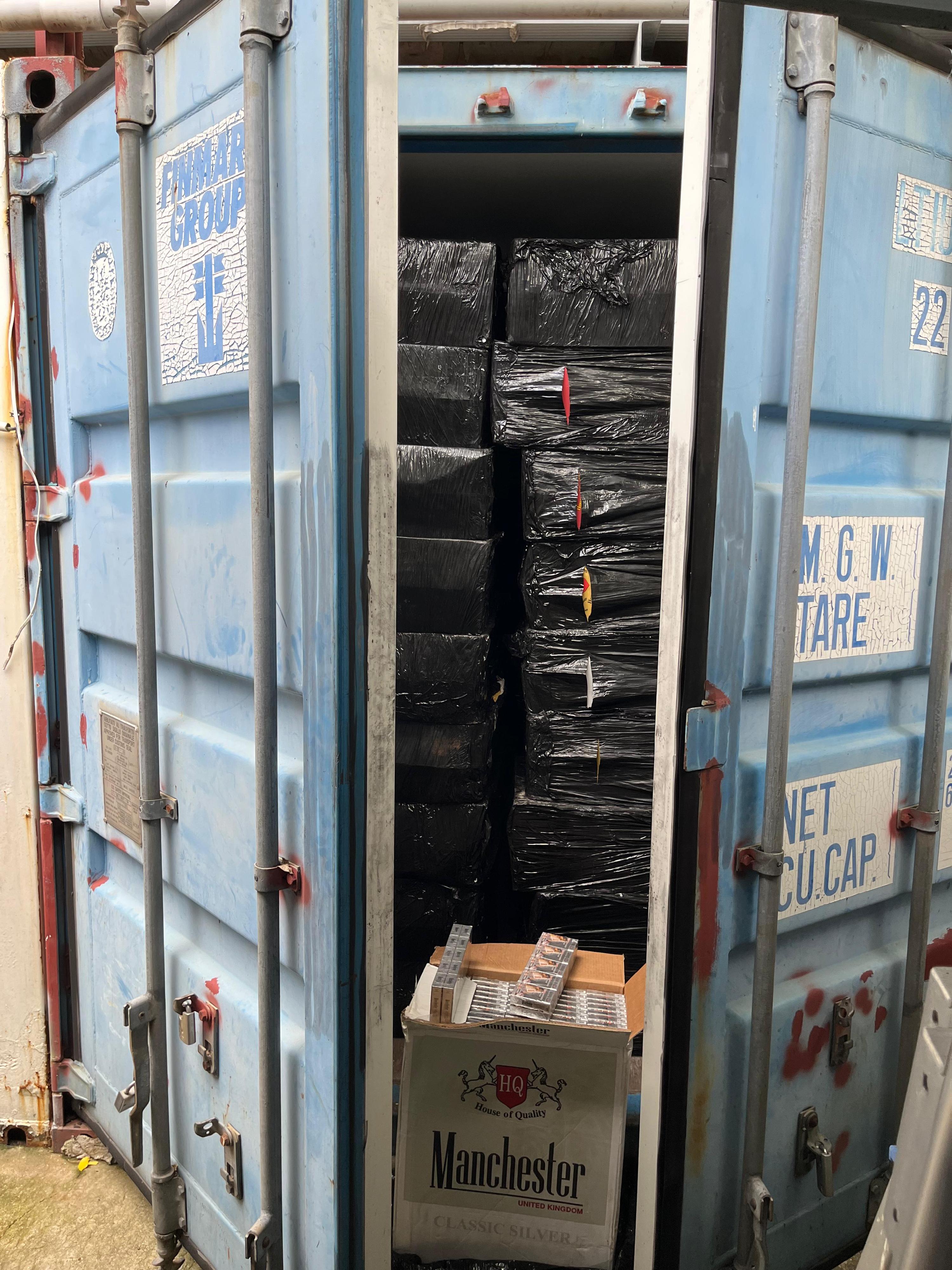 Hong Kong Customs yesterday (June 13) raided a large-scale storage centre in San Tin, Yuen Long, for suspected duty-not-paid cigarettes (commonly known as "cheap whites") and seized about 10.6 million suspected illicit cigarettes with an estimated market value of about $48 million and a duty potential of about $35 million. About 7.3 million suspected illicit cigarettes seized were "cheap whites", accounting for about 70 per cent of the total seizure. It was the largest case of "cheap whites" detected by Customs this year. Photo shows a container containing some of the suspected illicit cigarettes involved in the case.