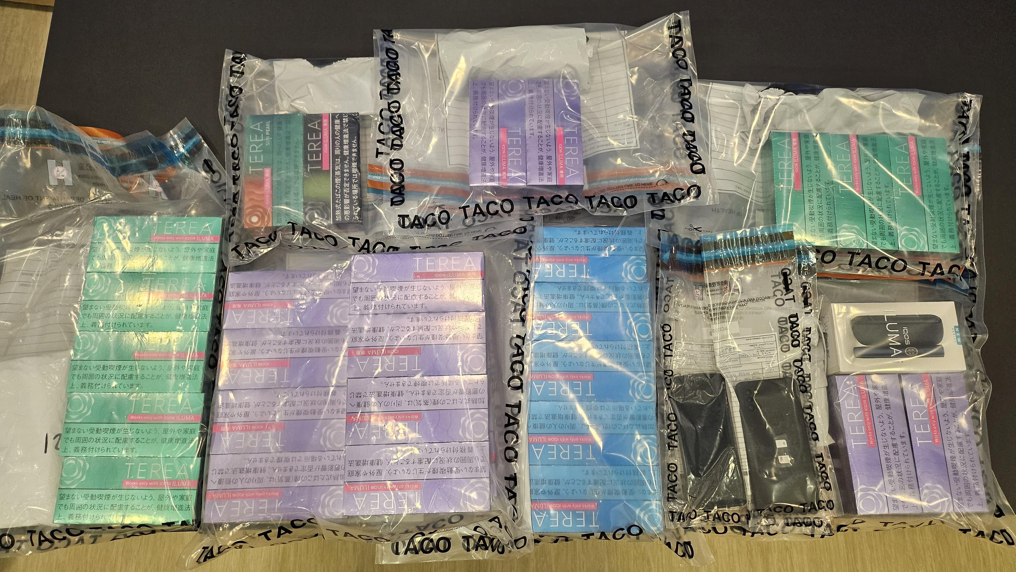 The Tobacco and Alcohol Control Office of the Department of Health today (June 21) conducted an enforcement operation against the illegal sale of alternative smoking products (ASPs). A heated tobacco device and a batch of 6 000 suspected ASPs were seized during the operation. Photo shows the heated tobacco device and suspected ASPs seized.