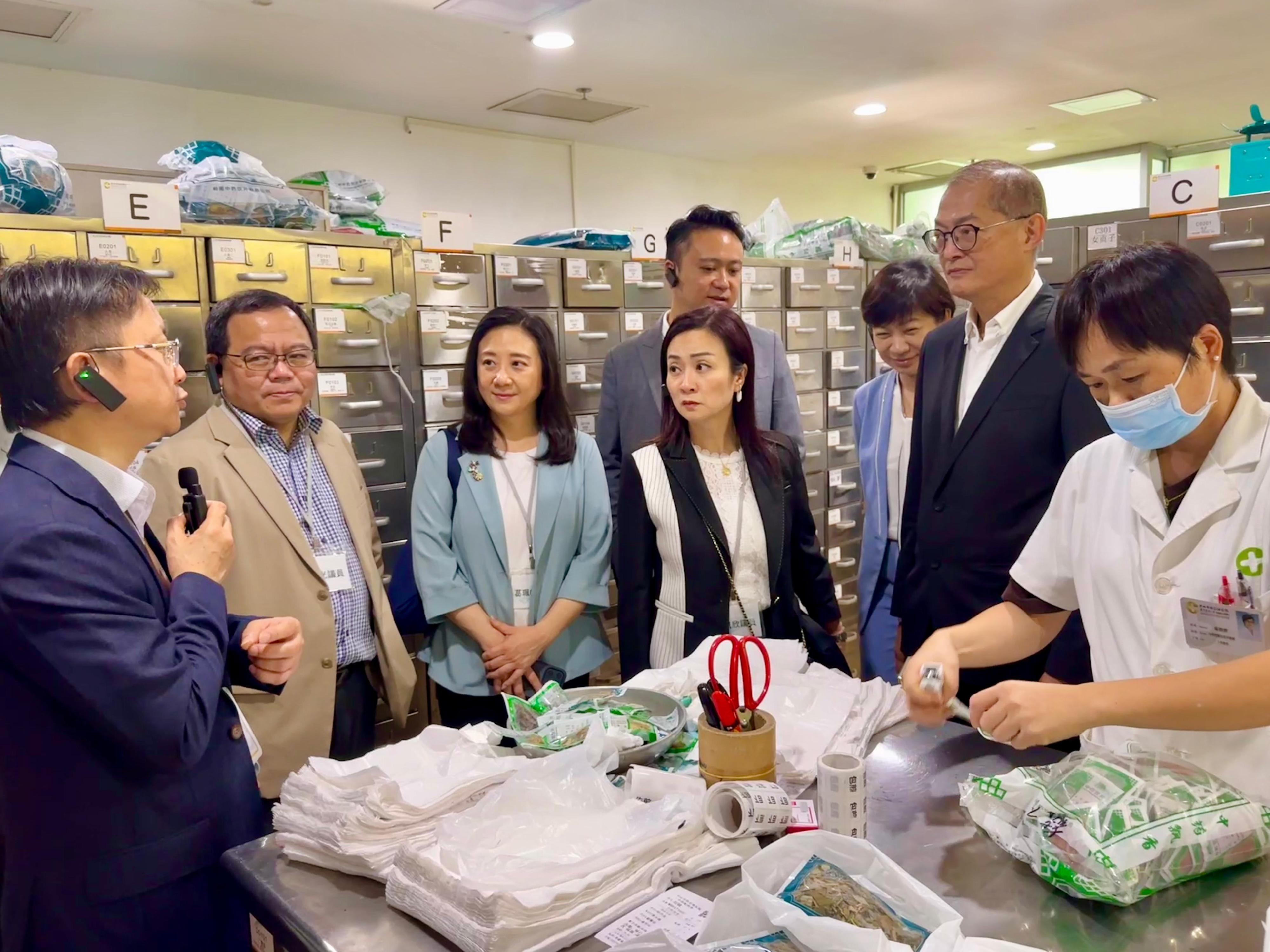 The Secretary for Health, Professor Lo Chung-mau (second right), together with the Chairman of the Legislative Council (LegCo) Panel on Health Services, Ms Chan Hoi-yan (fourth left); and other LegCo Members, visited ZhongShan Chenxinghai Hospital of Integrated Traditional Chinese and Western Medicine today (June 22). Photo shows the delegation receiving a briefing by the President of the hospital, Mr Huang Hanwei (first left), on its Health Construction Administration.