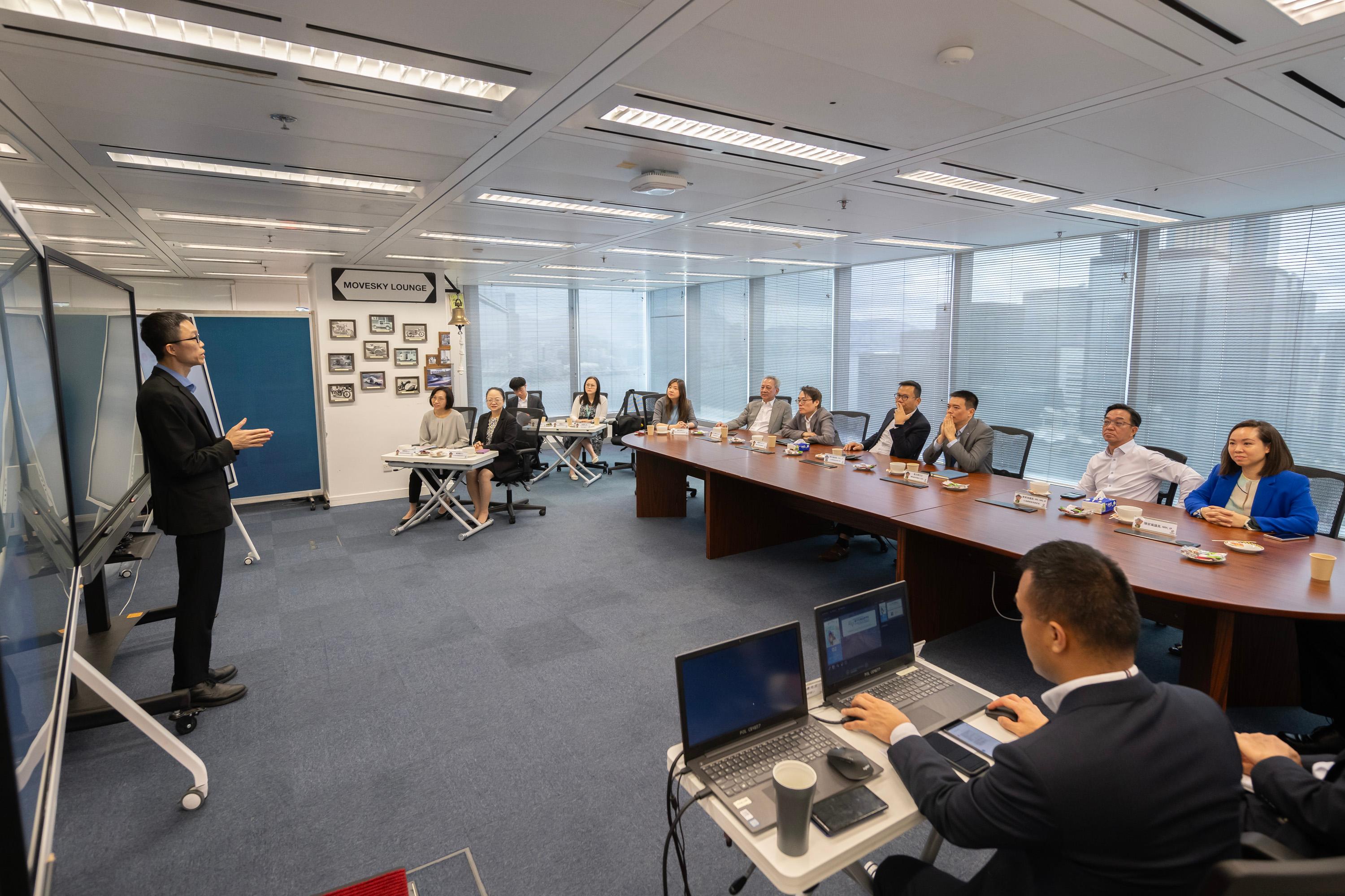 The Legislative Council Panel on Transport observes the demonstration of functions of eTraffic Ticket Platform at the Police Headquarters today (June 24).  Photo shows Members receiving a briefing by representatives of the Police on the progress and preparatory work for the electronic traffic enforcement.