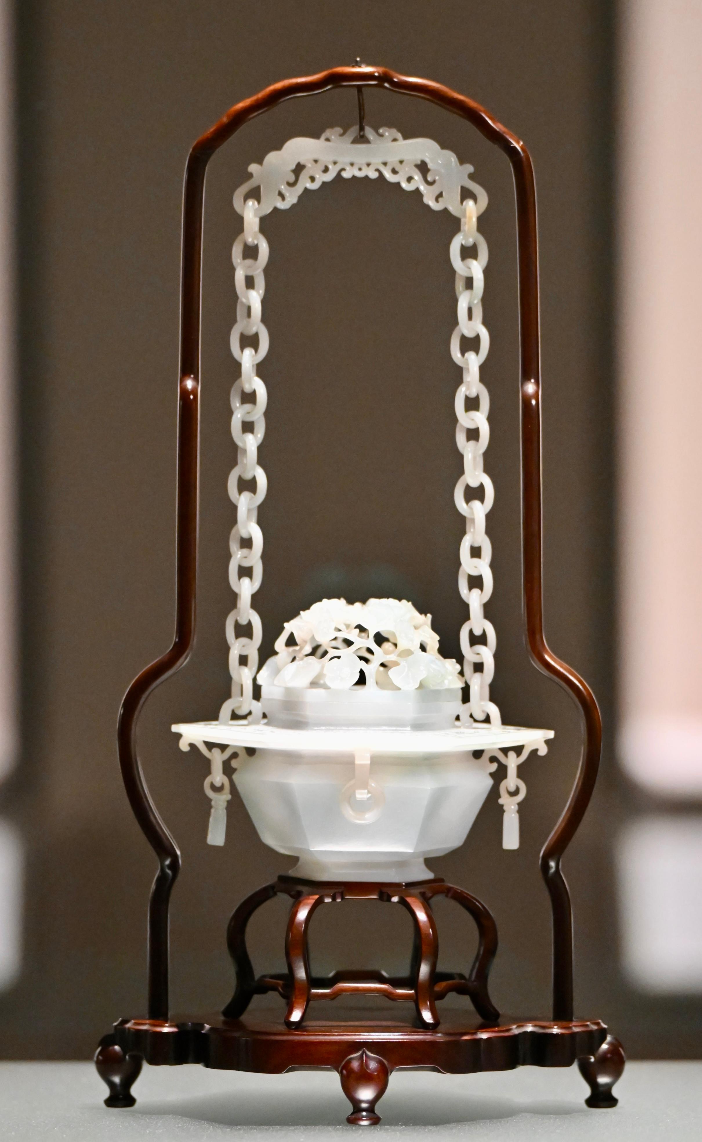 The opening ceremony of the "The Hong Kong Jockey Club Series: Fragrance of Time - In Search of Chinese Art of Scent" exhibition was held today (June 27) at the Hong Kong Museum of Art (HKMoA). Photo shows a hanging censer carved with an openwork floral design and six loop handles from the Qing dynasty of the HKMoA collection, exemplifying an exquisite jade-carving style.