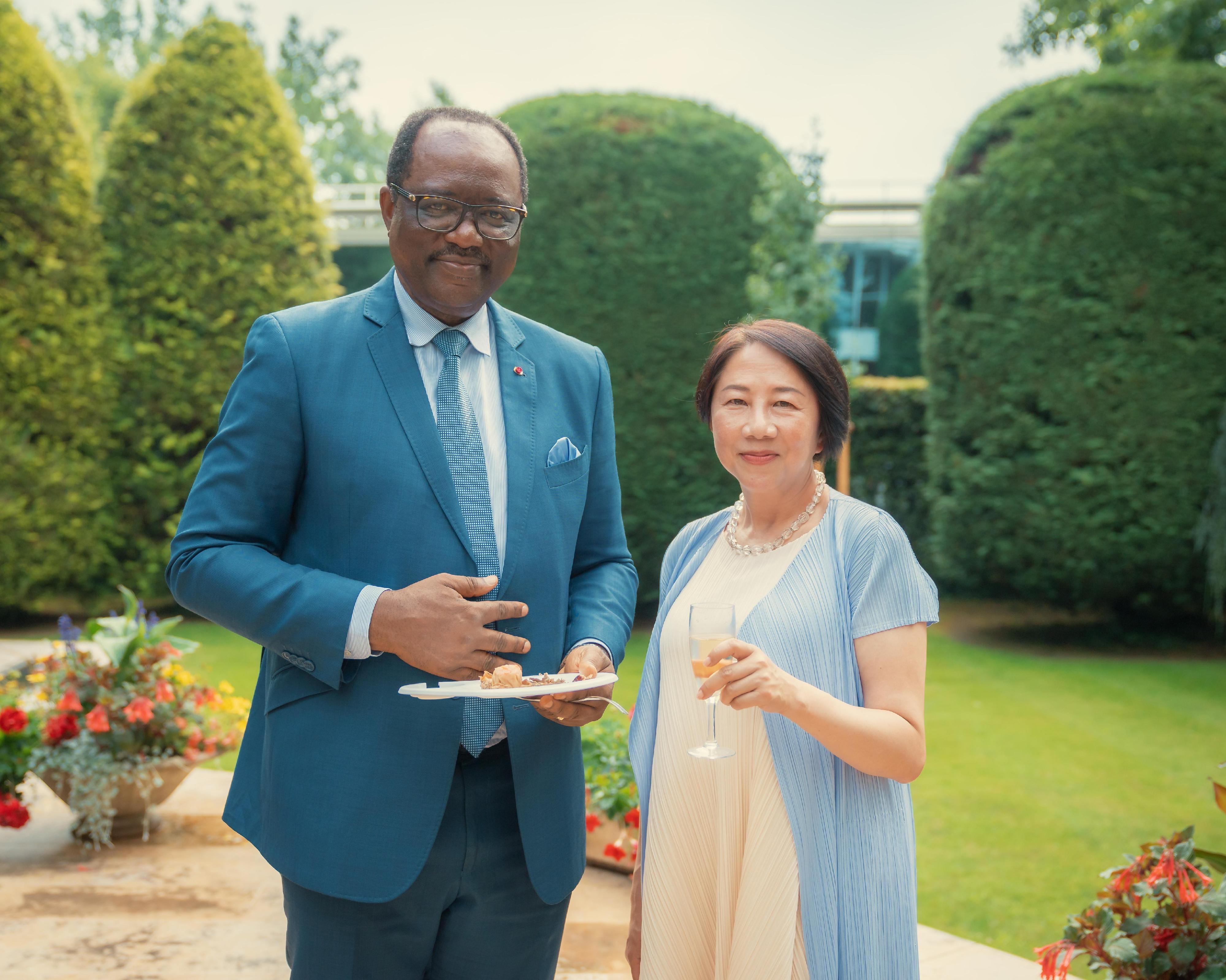 The Permanent Representative of the Hong Kong Special Administrative Region of China to the World Trade Organization (WTO), Miss Winky So (right), pictured at the reception with the Ambassador Extraordinary and Plenipotentiary, Permanent Representative of the Permanent Mission of the Republic of Cameroon to the United Nations Office and other International Organizations in Geneva, Mr Salomon Eheth. Cameroon will be hosting the 14th WTO  Ministerial Conference.