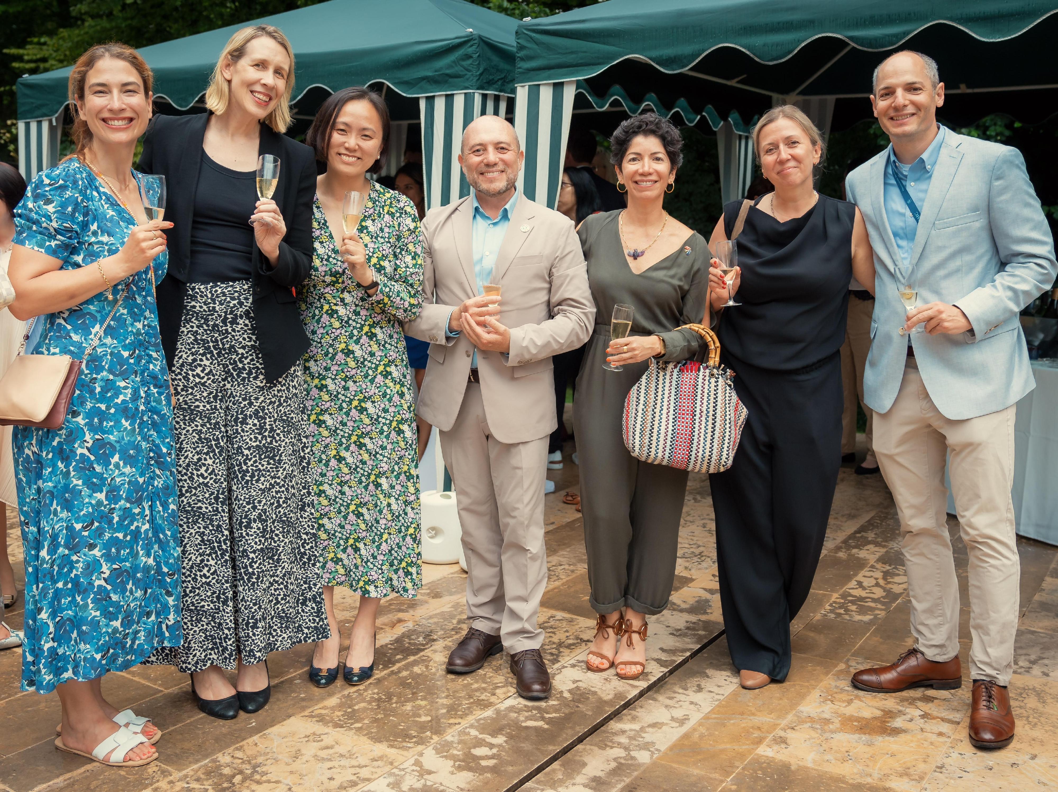 Deputy Representative of the Hong Kong Special Administrative Region of China to the World Trade Organization Miss Helen Kwan (third left), pictured at the reception with delegates from Australia, Costa Rica, the European Union, Israel and the United States.