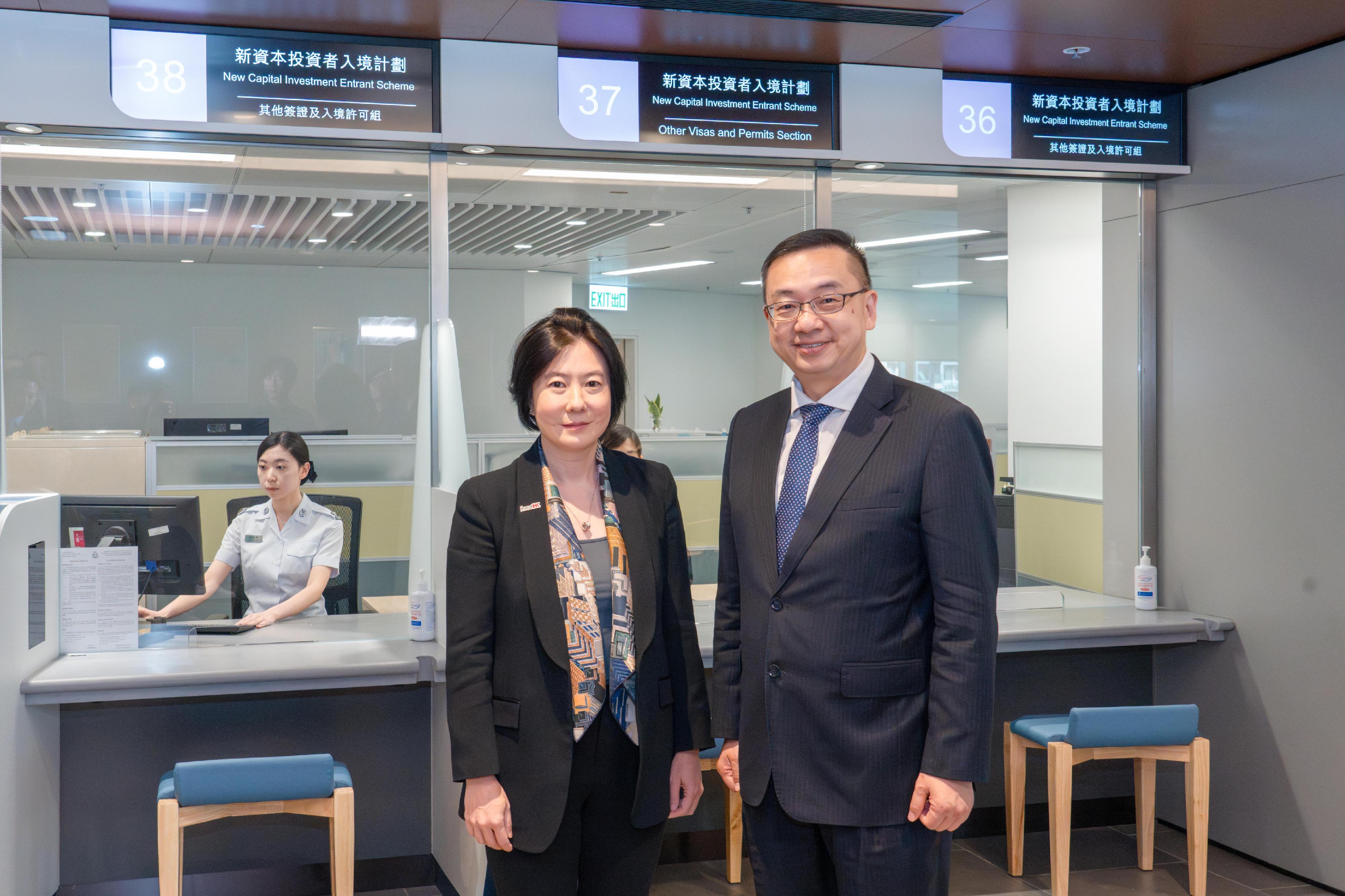 The Director of Immigration, Mr Benson Kwok (right) accompanies the Director-General of Invest Hong Kong, Ms Alpha Lau (left) to visit the office responsible for processing applications of New Capital Investment Entrant Scheme situated in the new headquarters of the Immigration Department in Tseung Kwan O.