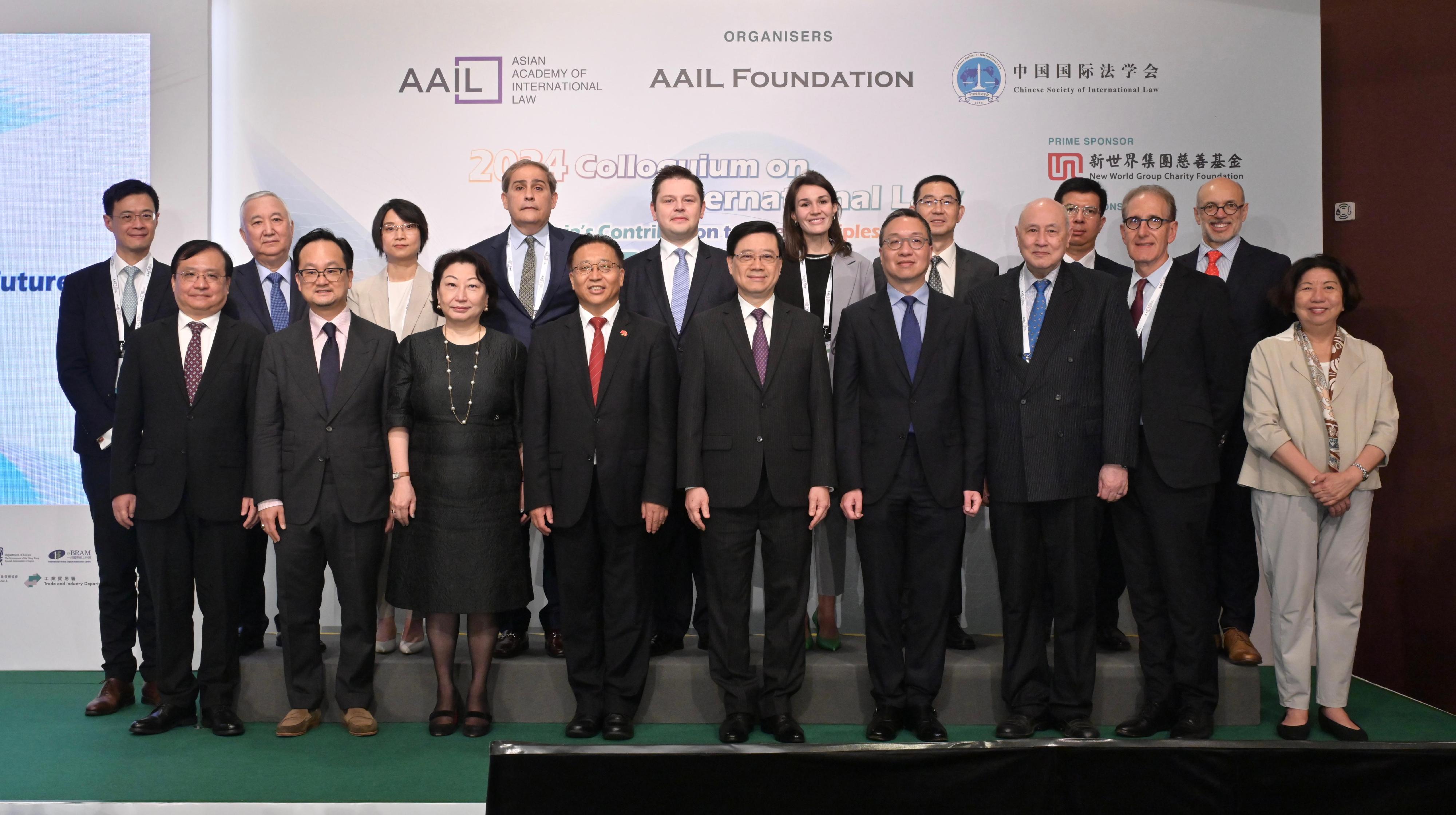 The Chief Executive, Mr John Lee, attended the 2024 Colloquium on International Law today (July 5). Photo shows (front row, from third left) Founder Member and Co-Chairman of the Asian Academy of International Law (AAIL) Ms Teresa Cheng, SC; the Commissioner of the Ministry of Foreign Affairs in the Hong Kong Special Administrative Region, Mr Cui Jianchun; Mr Lee; the Secretary for Justice, Mr Paul Lam, SC; Co-Chairman of the AAIL Dr Anthony Neoh and other guests at the conference.