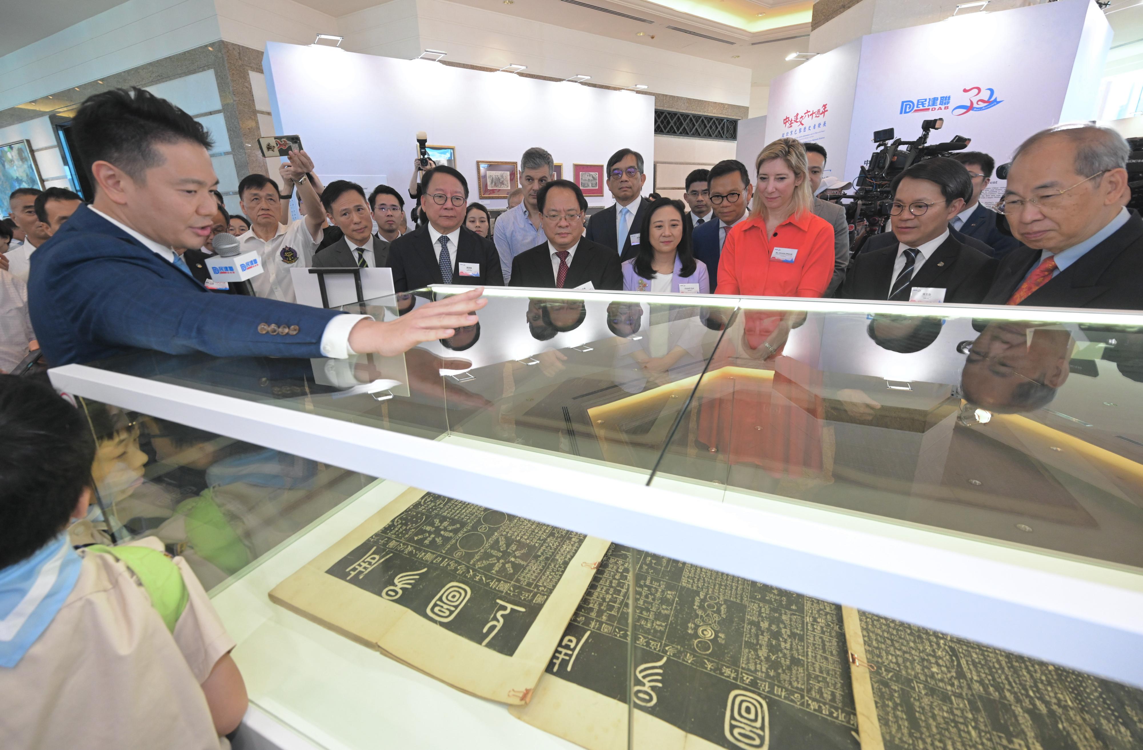 The Chief Secretary for Administration, Mr Chan Kwok-ki, attended the opening ceremony of the 60th Anniversary of the Establishment of China-France Diplomatic Relations - Evolving Cities: Beijing & Paris exhibition today (July 6). Photo shows Mr Chan (fourth left) touring the exhibition.