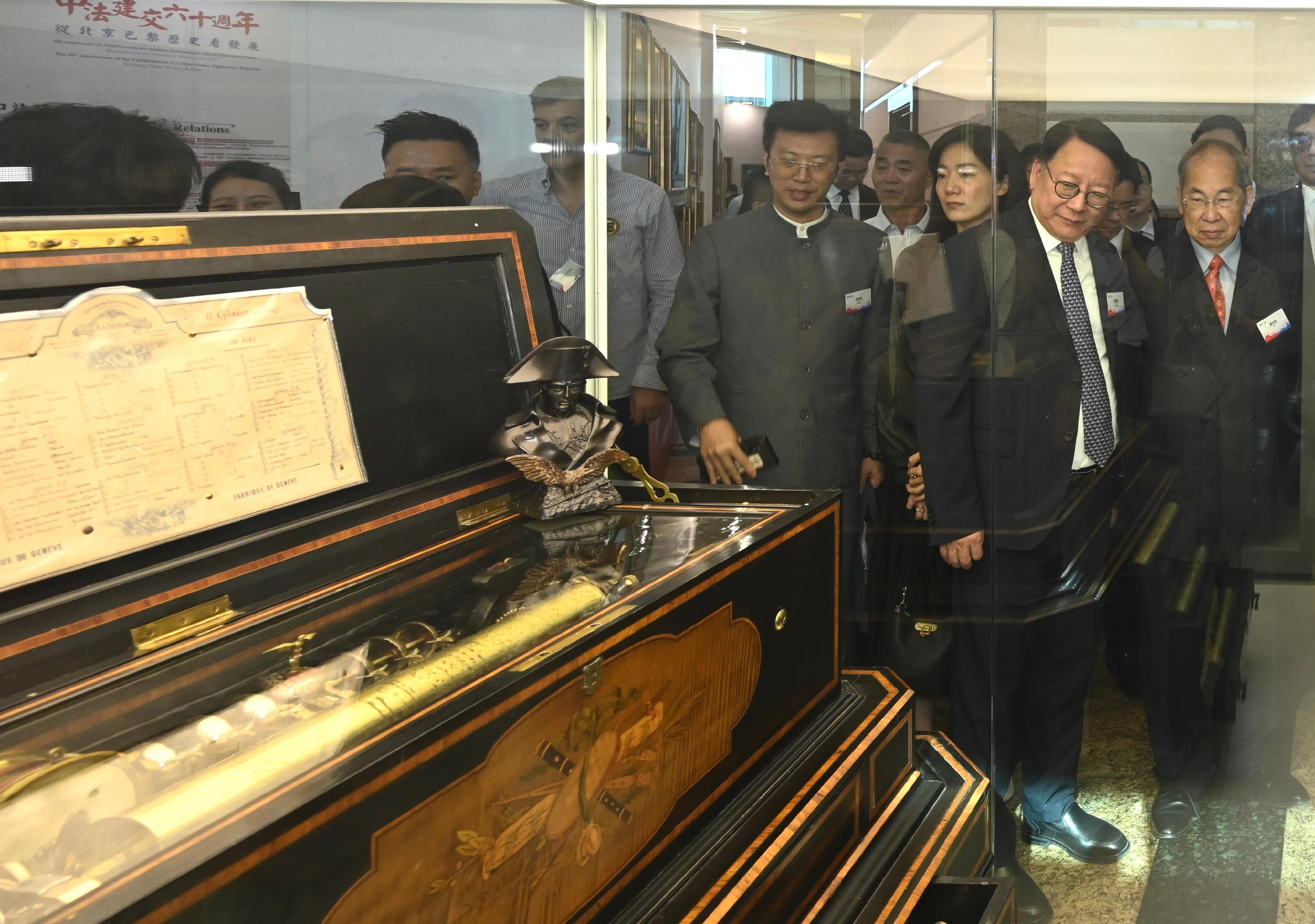 The Chief Secretary for Administration, Mr Chan Kwok-ki, attended the opening ceremony of the 60th Anniversary of the Establishment of China-France Diplomatic Relations - Evolving Cities: Beijing & Paris exhibition today (July 6). Photo shows Mr Chan (second right) touring the exhibition.