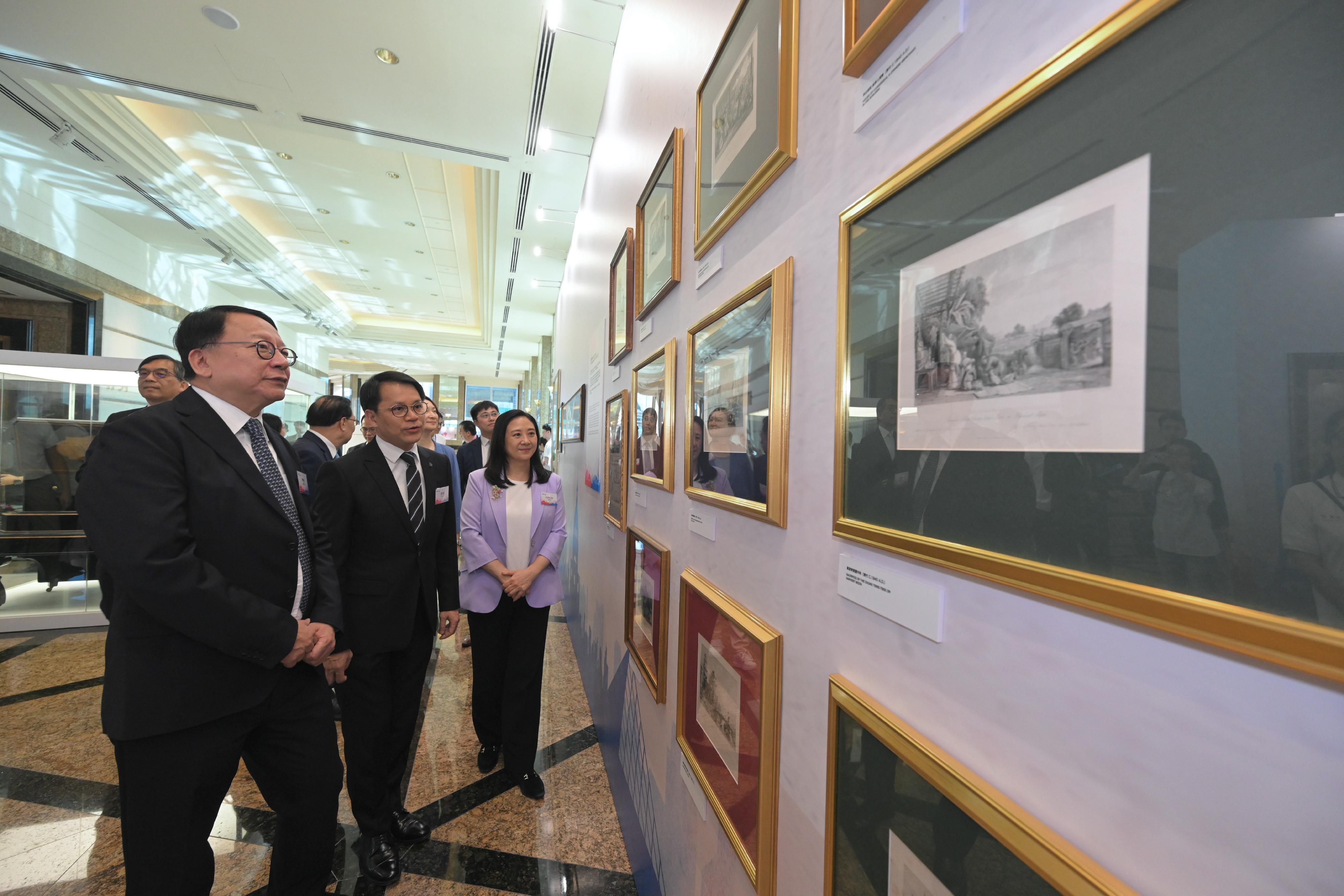 The Chief Secretary for Administration, Mr Chan Kwok-ki, attended the opening ceremony of the 60th Anniversary of the Establishment of China-France Diplomatic Relations - Evolving Cities: Beijing & Paris exhibition today (July 6). Photo shows Mr Chan (first left) touring the exhibition.