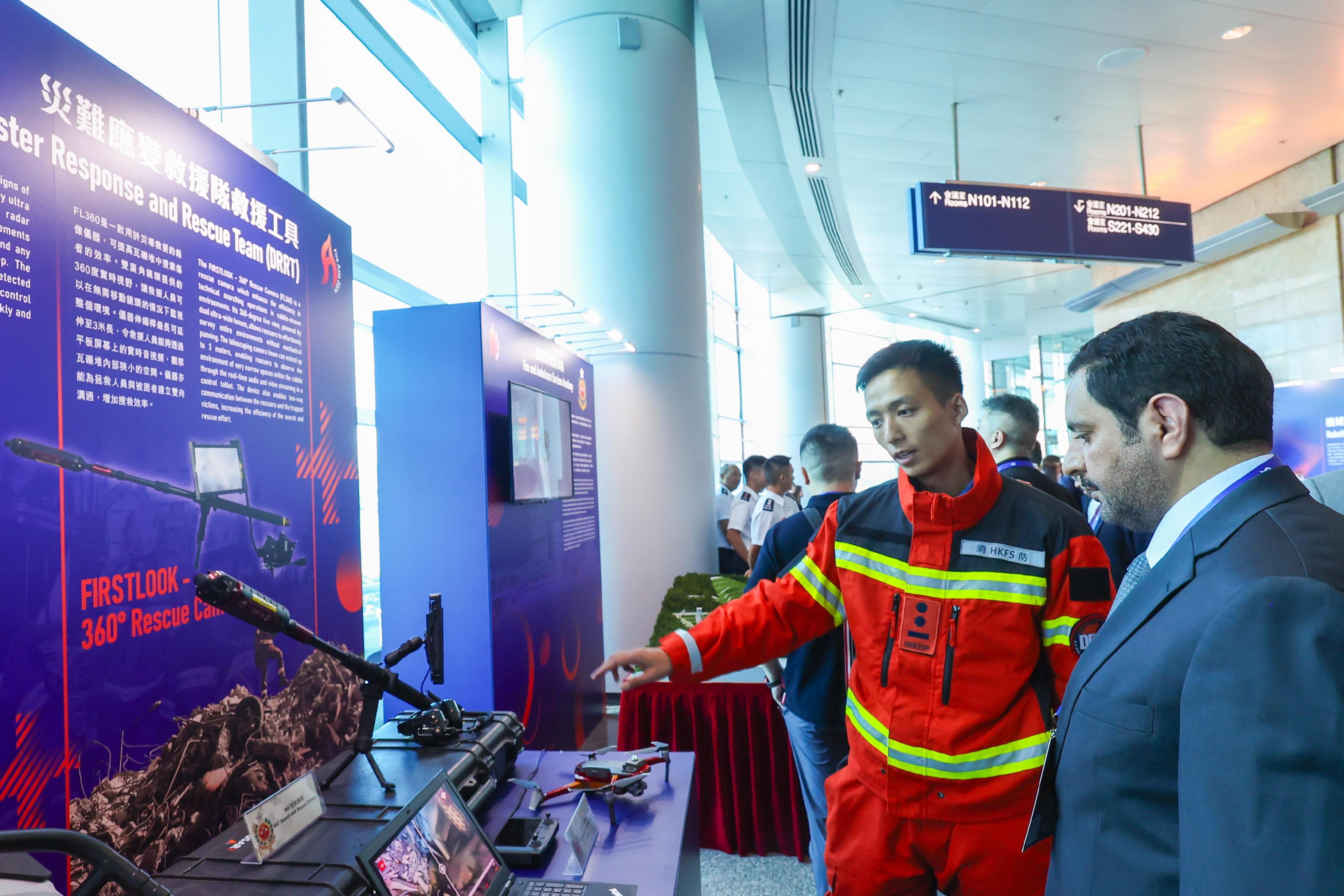 About 600 experts and delegates in emergency response, paramedic services, medical professions and fire engineering from various countries and regions are taking part in the Fire Asia 2024 international conference being held at the Hong Kong Convention and Exhibition Centre from today (July 10) to July 12. Photo shows a participant observing rescue technology equipment exhibited by the Hong Kong Fire Services Department.