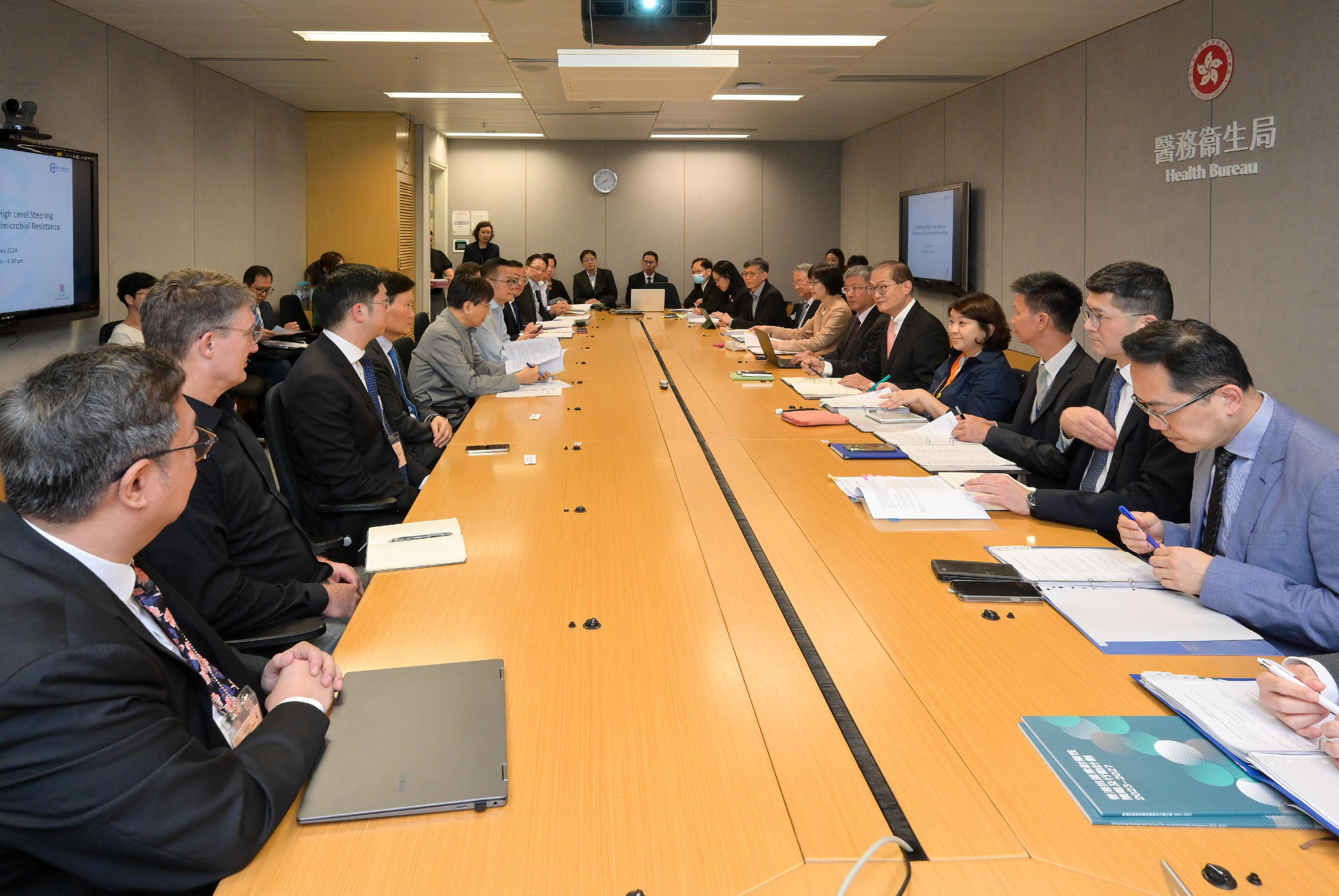 The Secretary for Health, Professor Lo Chung-mau (fifth right), convenes the ninth meeting of the High Level Steering Committee on Antimicrobial Resistance today (July 11) to review the implementation of the Hong Kong Strategy and Action Plan on Antimicrobial Resistance (2023-2027) and discuss the response strategies with relevant government departments and organisations.